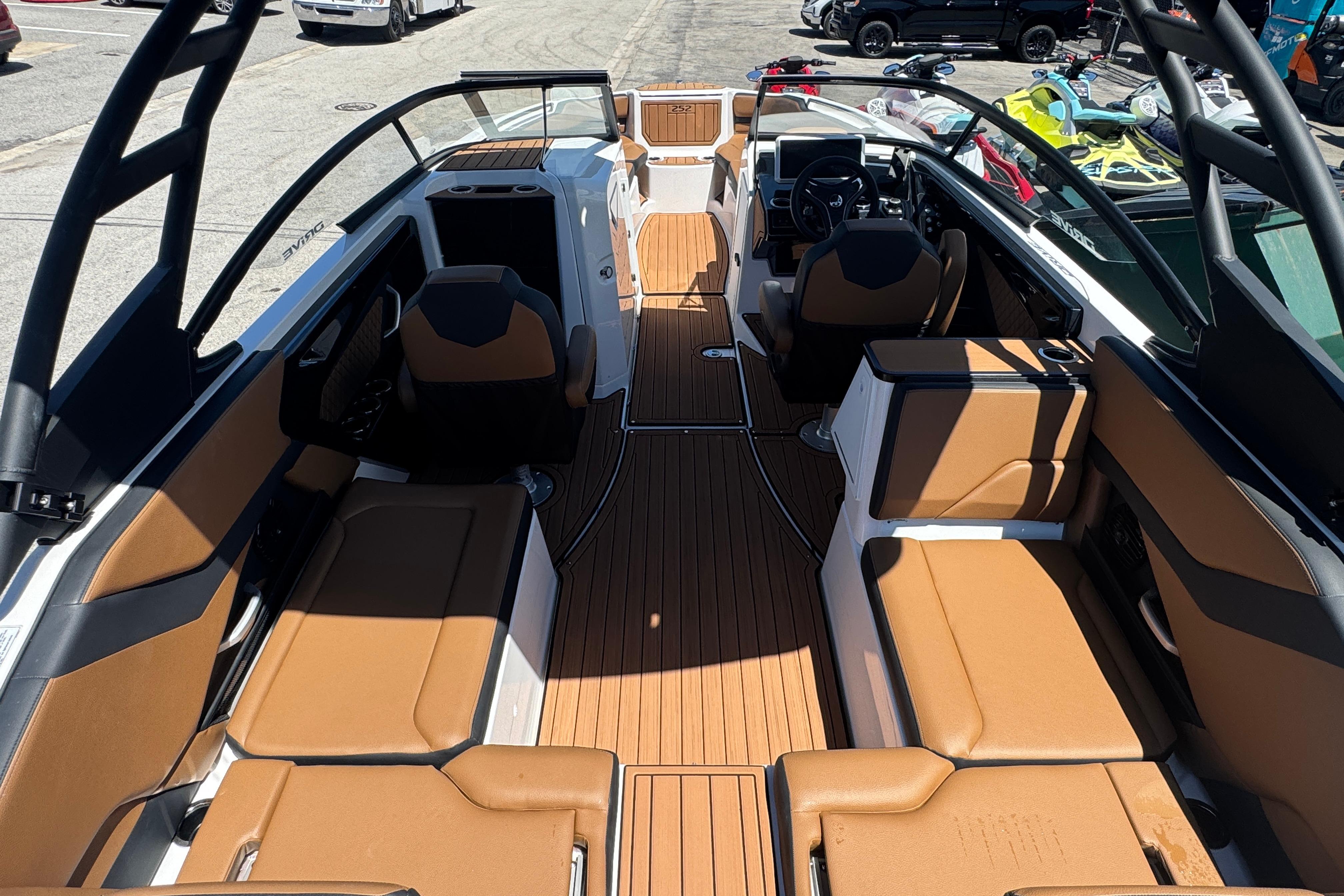 2026 Yamaha Boats 252SD interior with tan seating and sleek design.