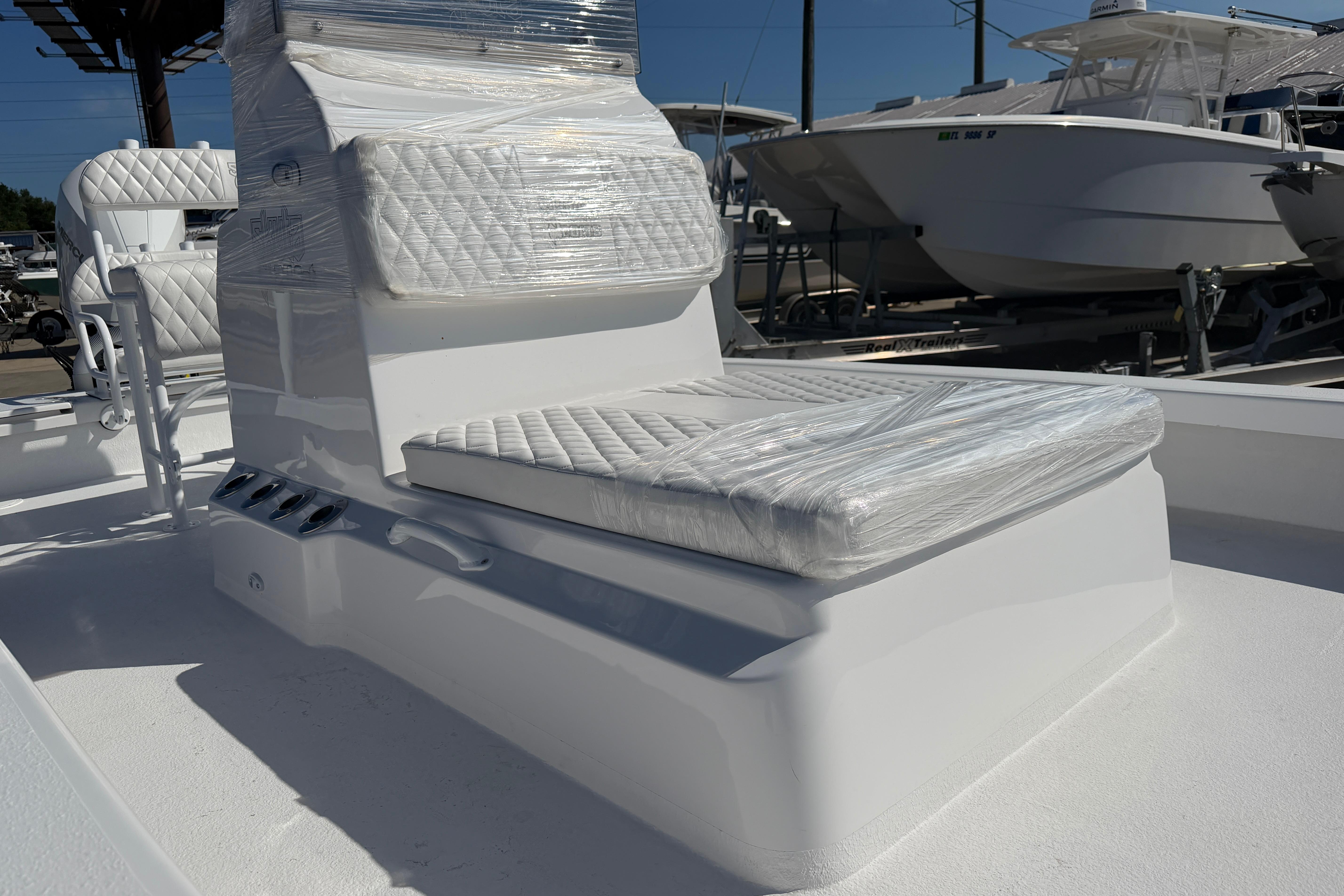 2026 Skuta 24 Cat boat with wrapped seating, showcasing sleek design and modern features.