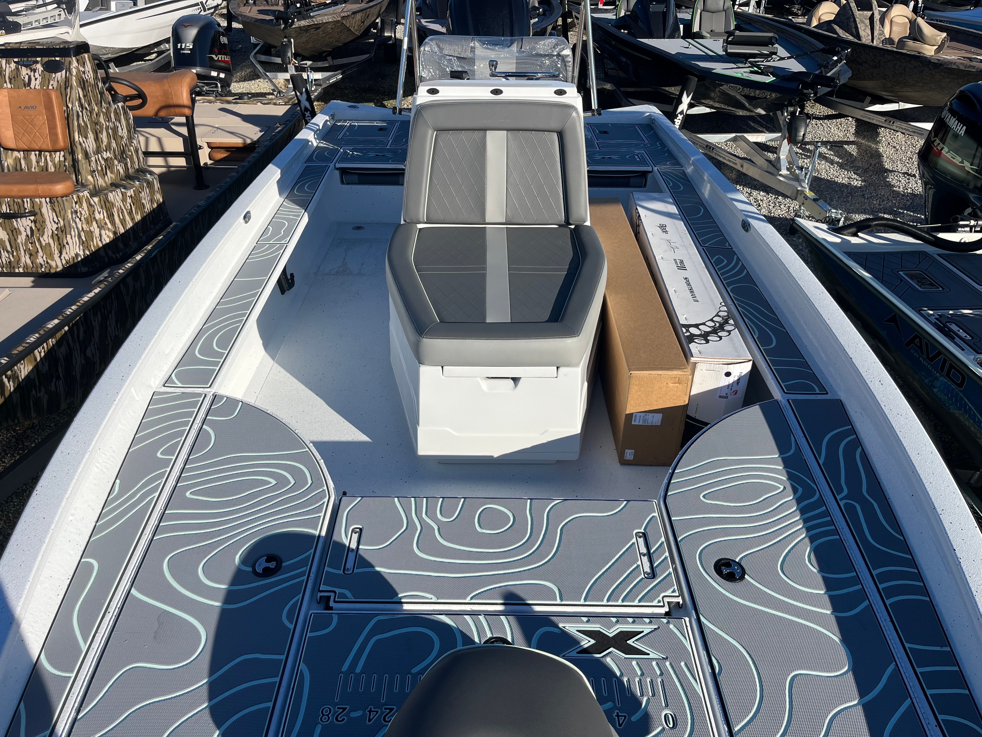 2024 Xpress X23B Bay Lounge boat in harbor.