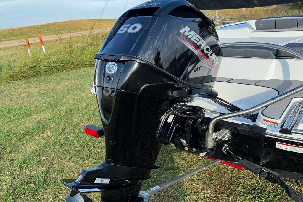 2026 Tahoe T16 boat with Mercury 50 outboard motor on grassy area.