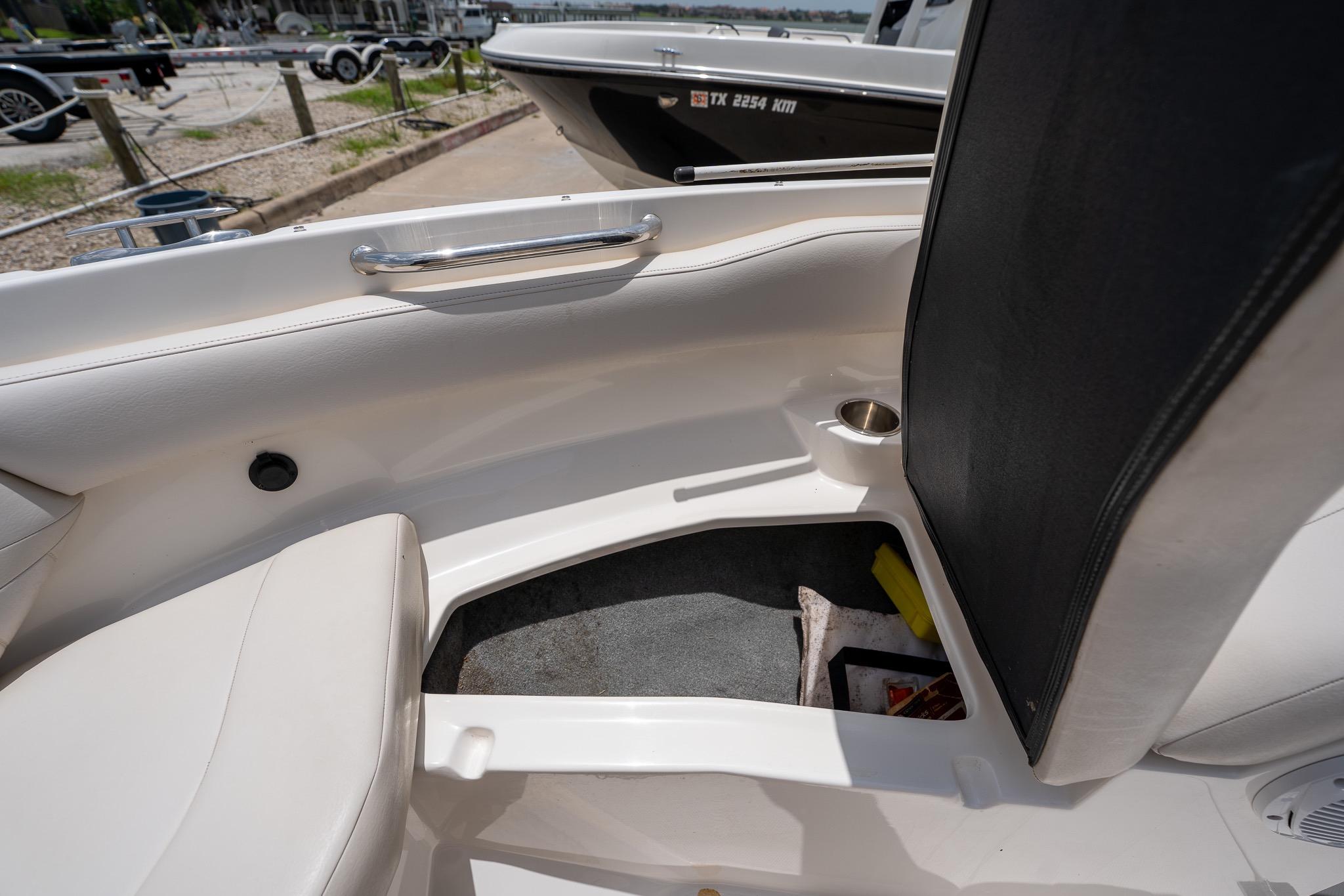 Interior of a 2008 Regal 2000 Bowrider boat, featuring seating and cup holder.
