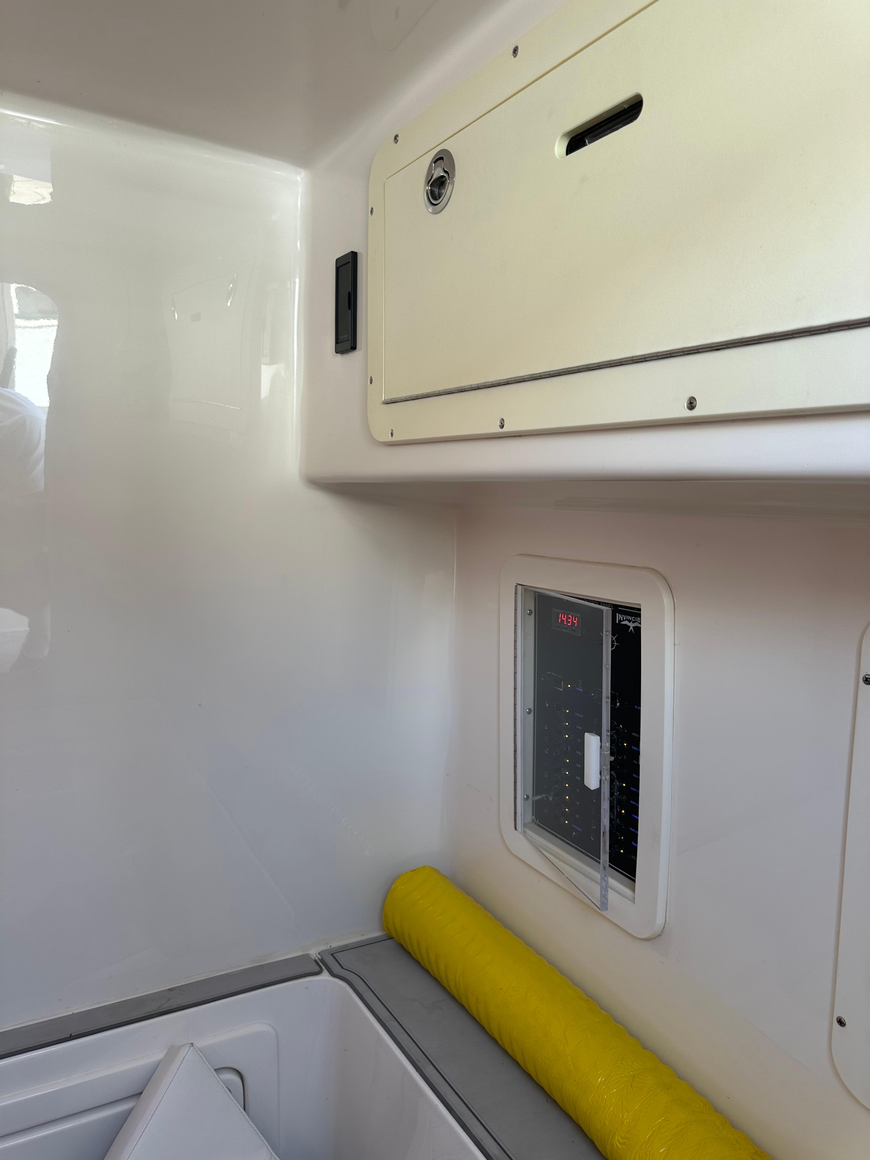 2016 Invincible Open Fisherman interior storage and control panel.