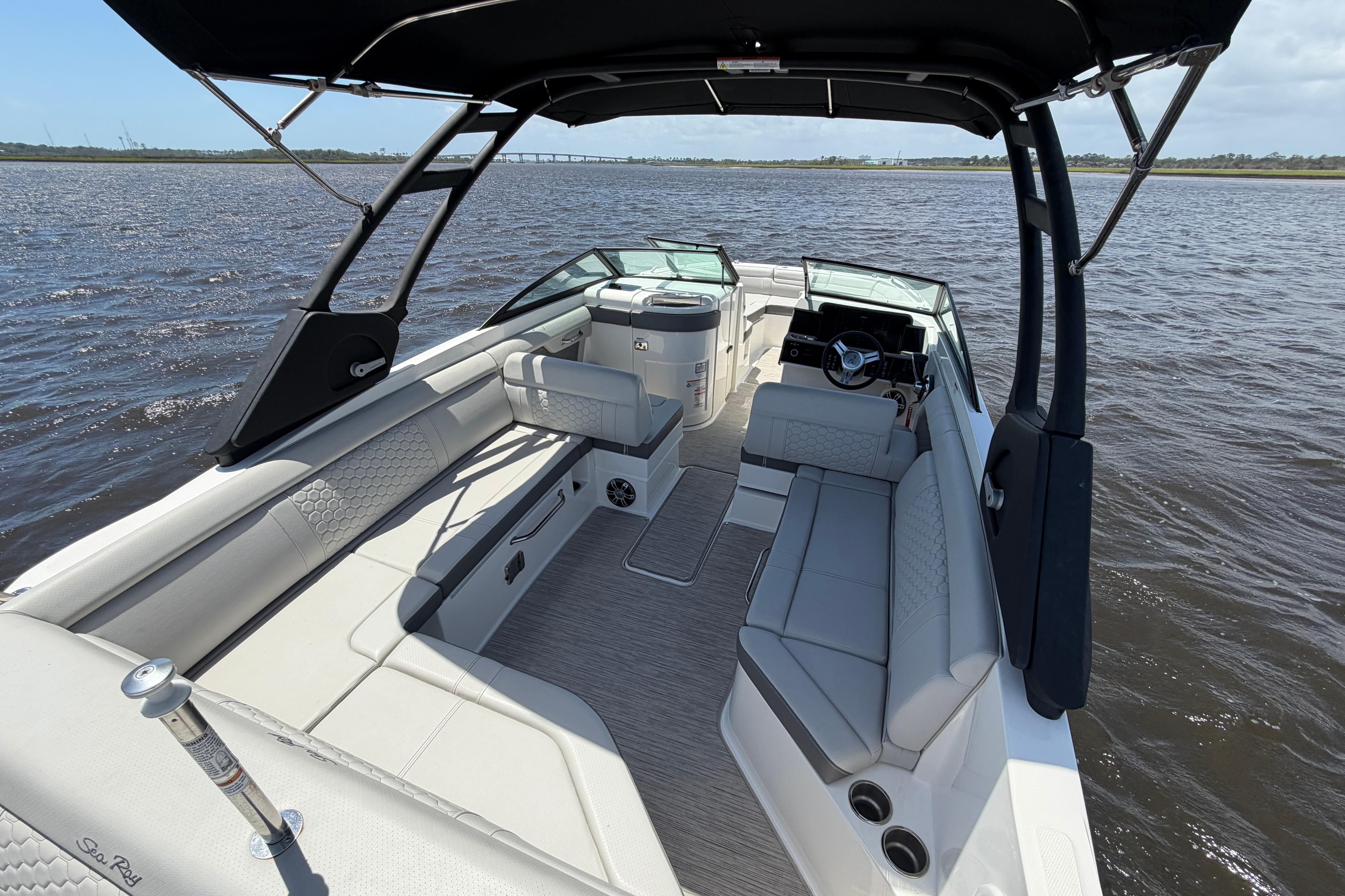 2024 Sea Ray SDX 270 Outboard boat interior with spacious seating on open water.