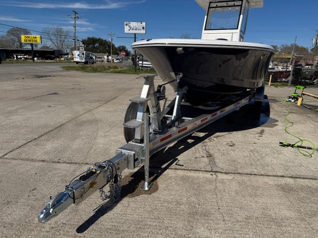 2025 Robalo 266 Cayman boat on trailer in outdoor setting.