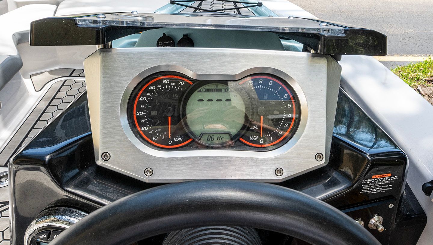 Dashboard of a 2018 Scarab 165 ID boat with speedometer and tachometer.