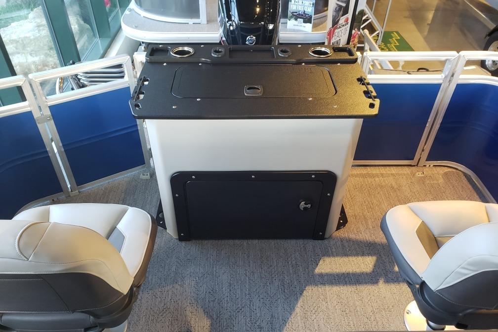 Interior of 2026 Sun Tracker Fishin' Barge 20 DLX with seating and control panel.