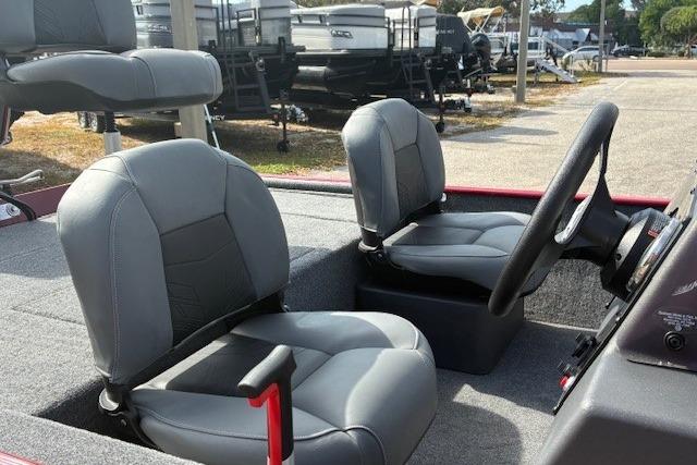 2025 Tracker Bass Tracker Classic XL boat interior with gray seating and steering wheel.