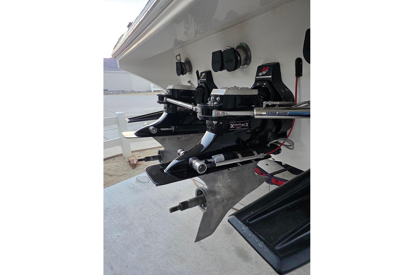 2004 Fountain 38 Lightning boat stern with dual propeller drives and hydraulic steering.