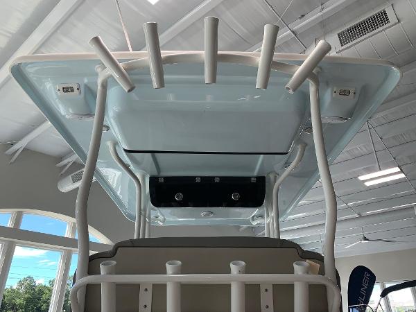 2024 Key West 263 FS boat interior view with rod holders and T-top.