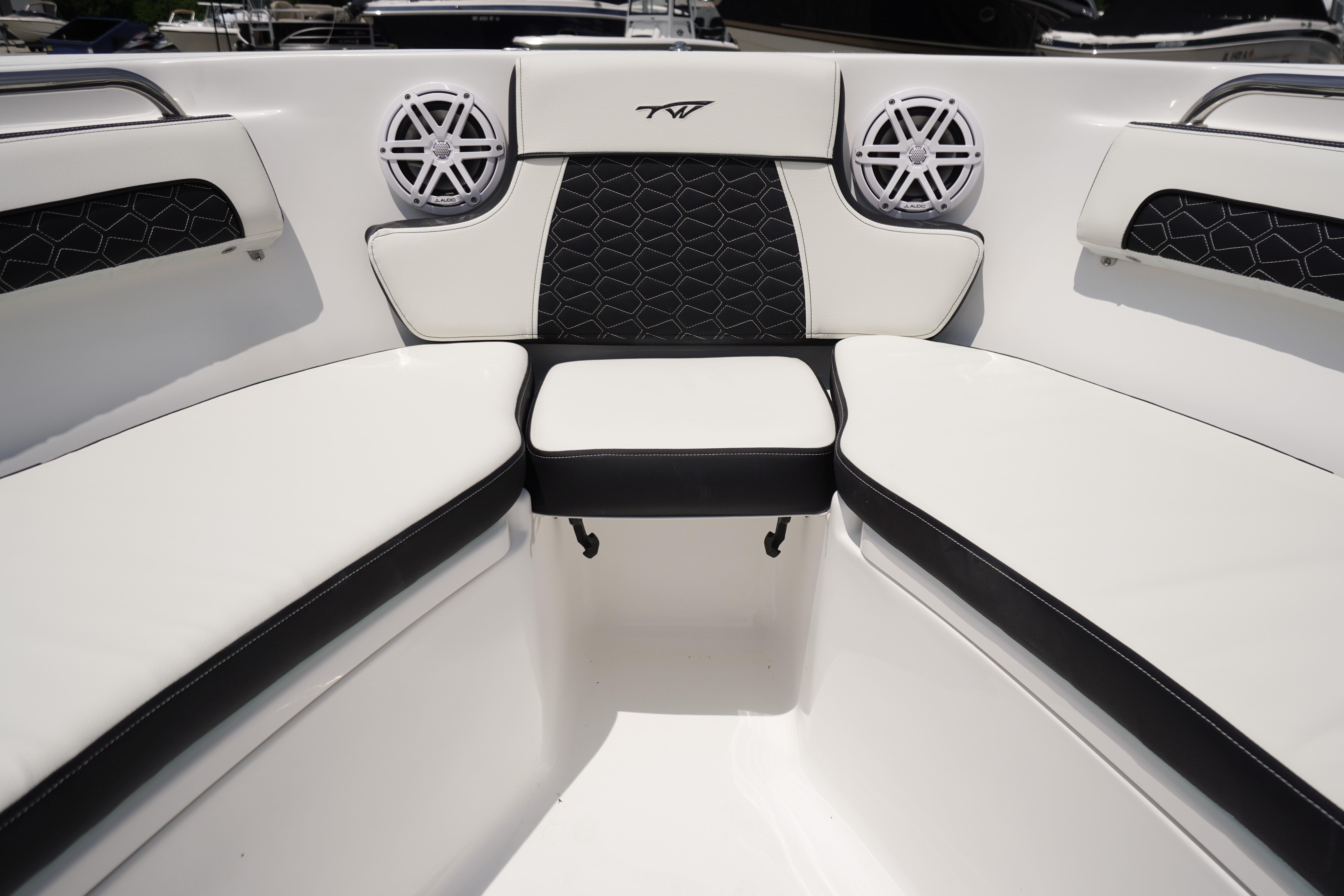 Interior seating of 2027 Tidewater 220 CC Adventure boat, featuring stylish black and white upholstery.