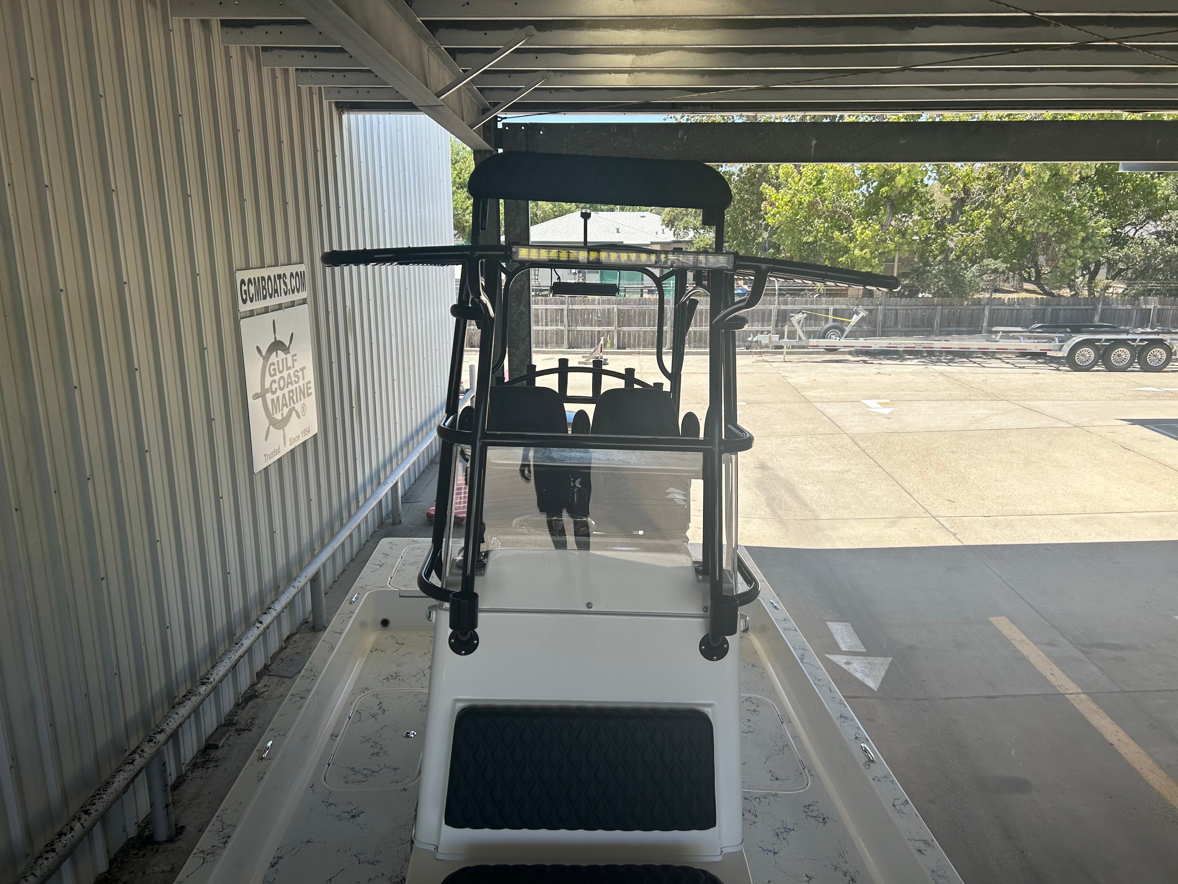 2023 Shallow Sport 25 X3 boat in a warehouse.