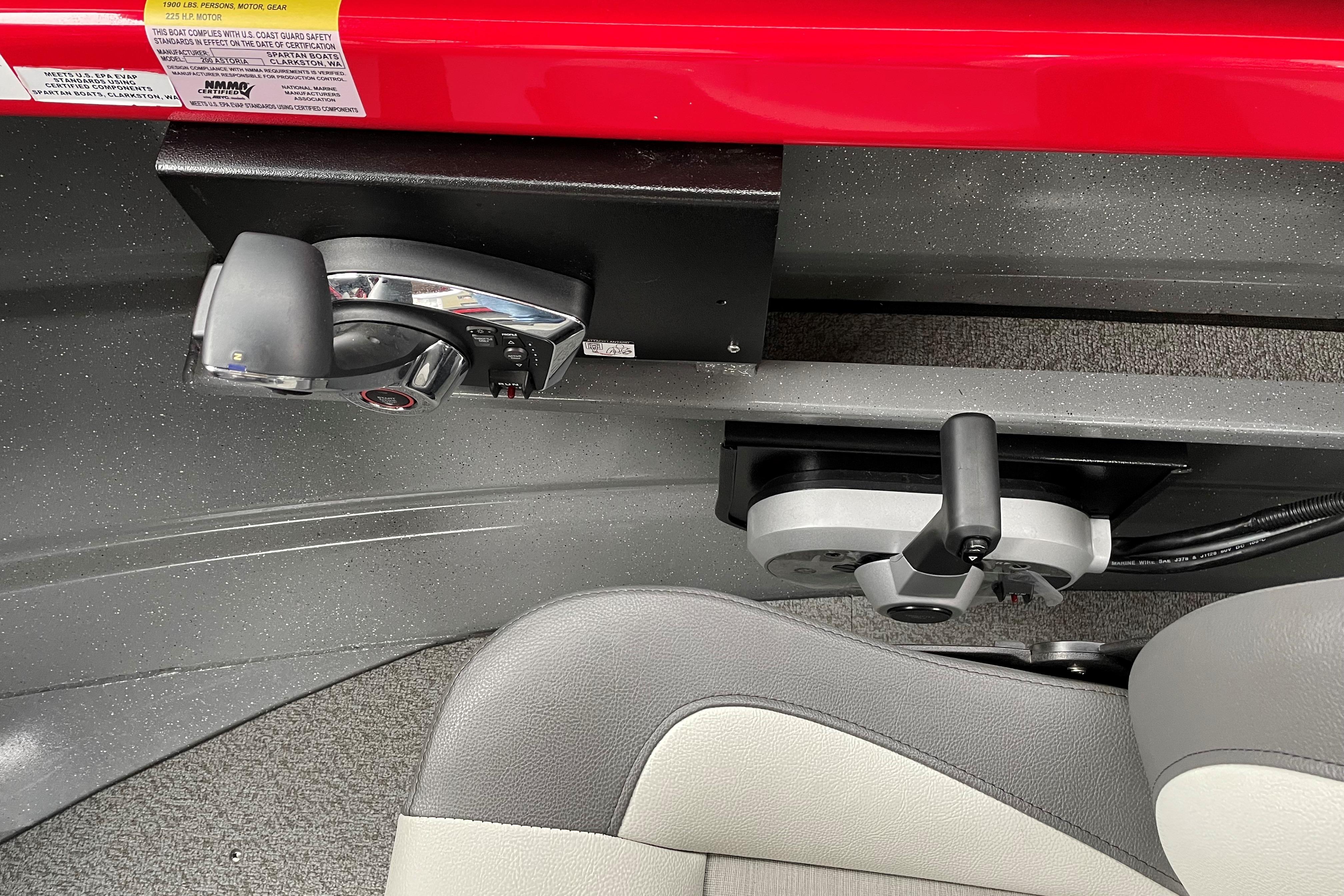 2024 Spartan 200 Astoria boat controls and seating detail, featuring modern design and functionality.