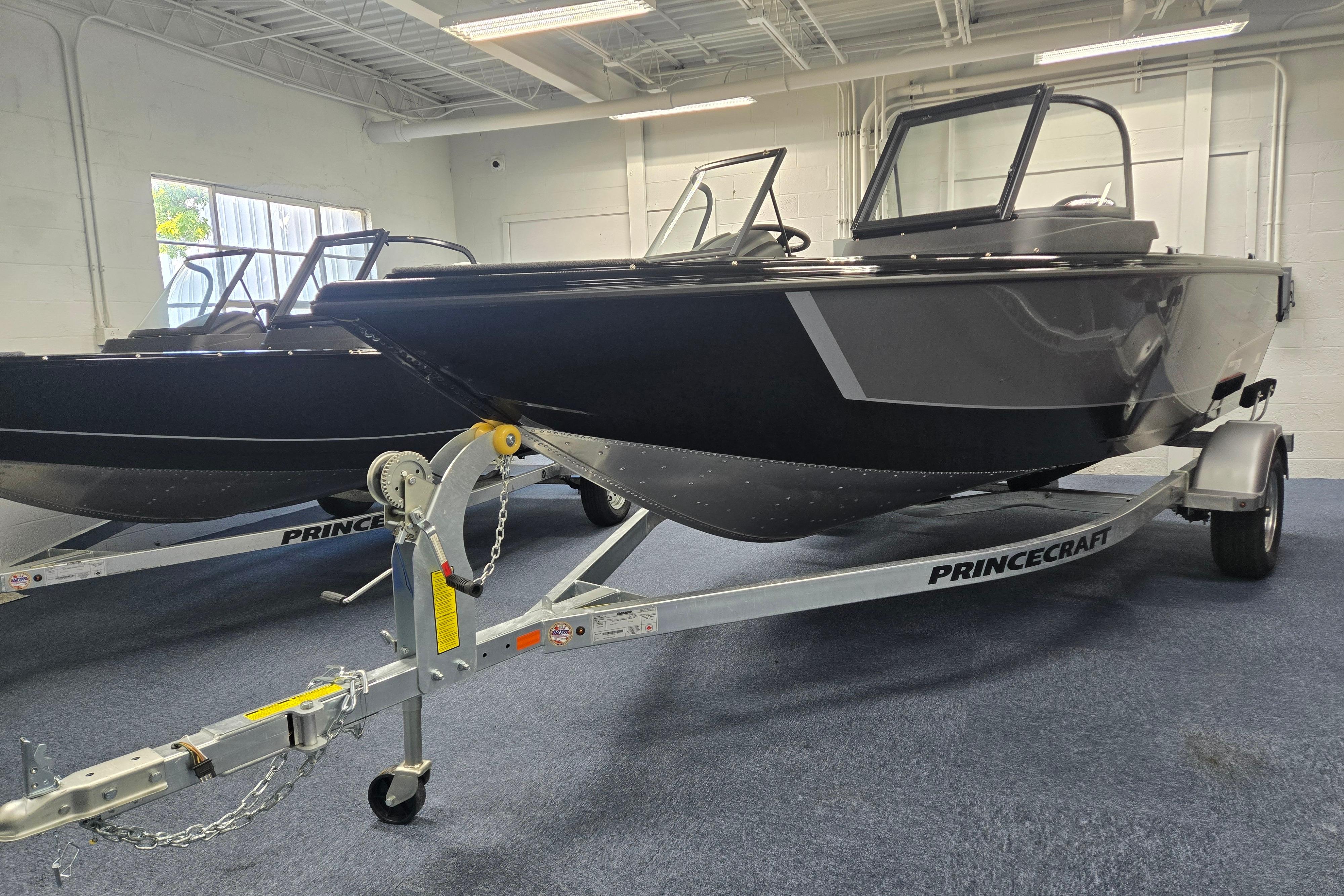 2026 Princecraft Sport 175 MAX boat on trailer in showroom.