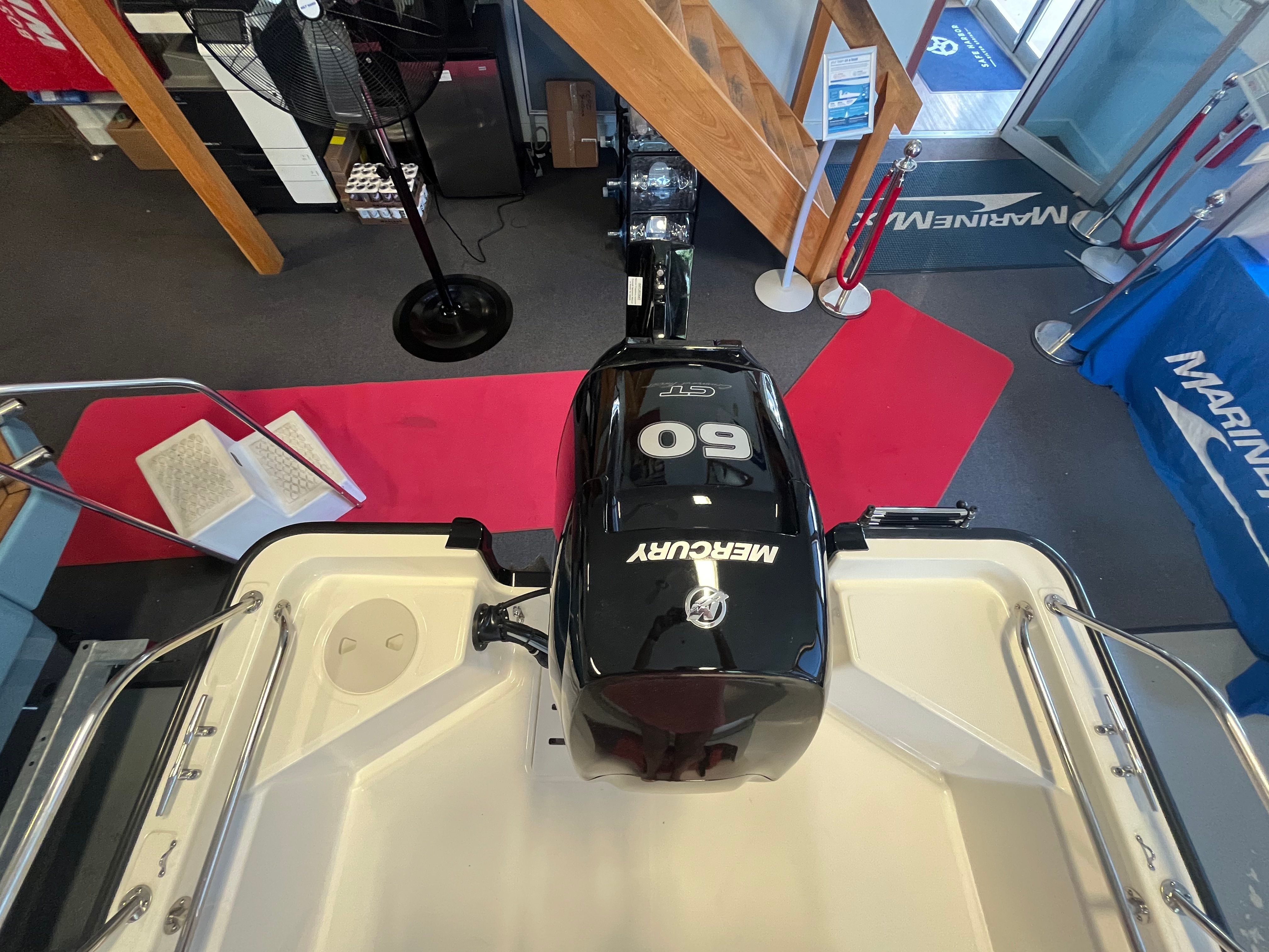 Interior view of a Boston Whaler 150 Montauk with a Mercury 60 HP engine.