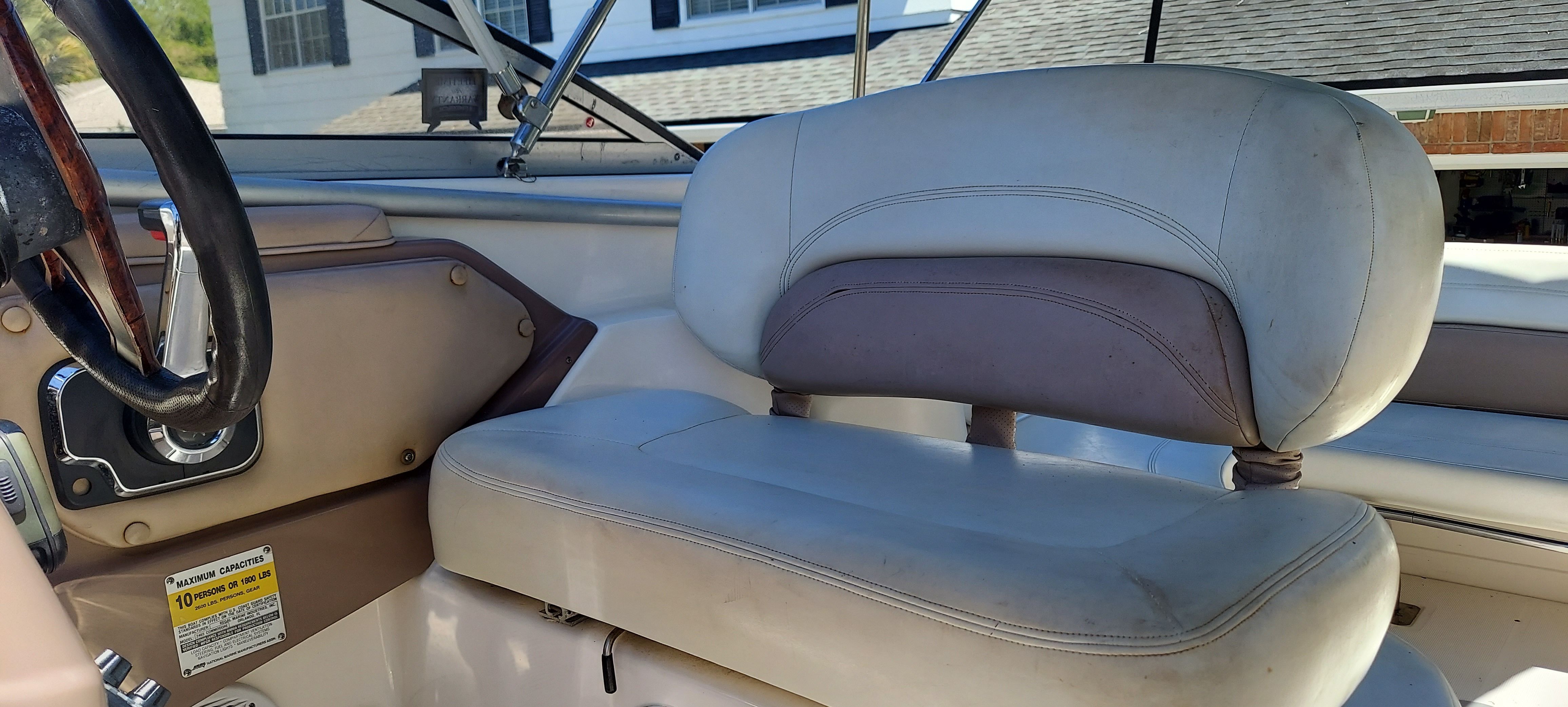 Interior of a 2004 Regal Commodore 2465 boat with helm seat.