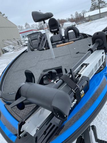 2023 Nitro Z20 fishing boat with Minn Kota trolling motor on snowy day.