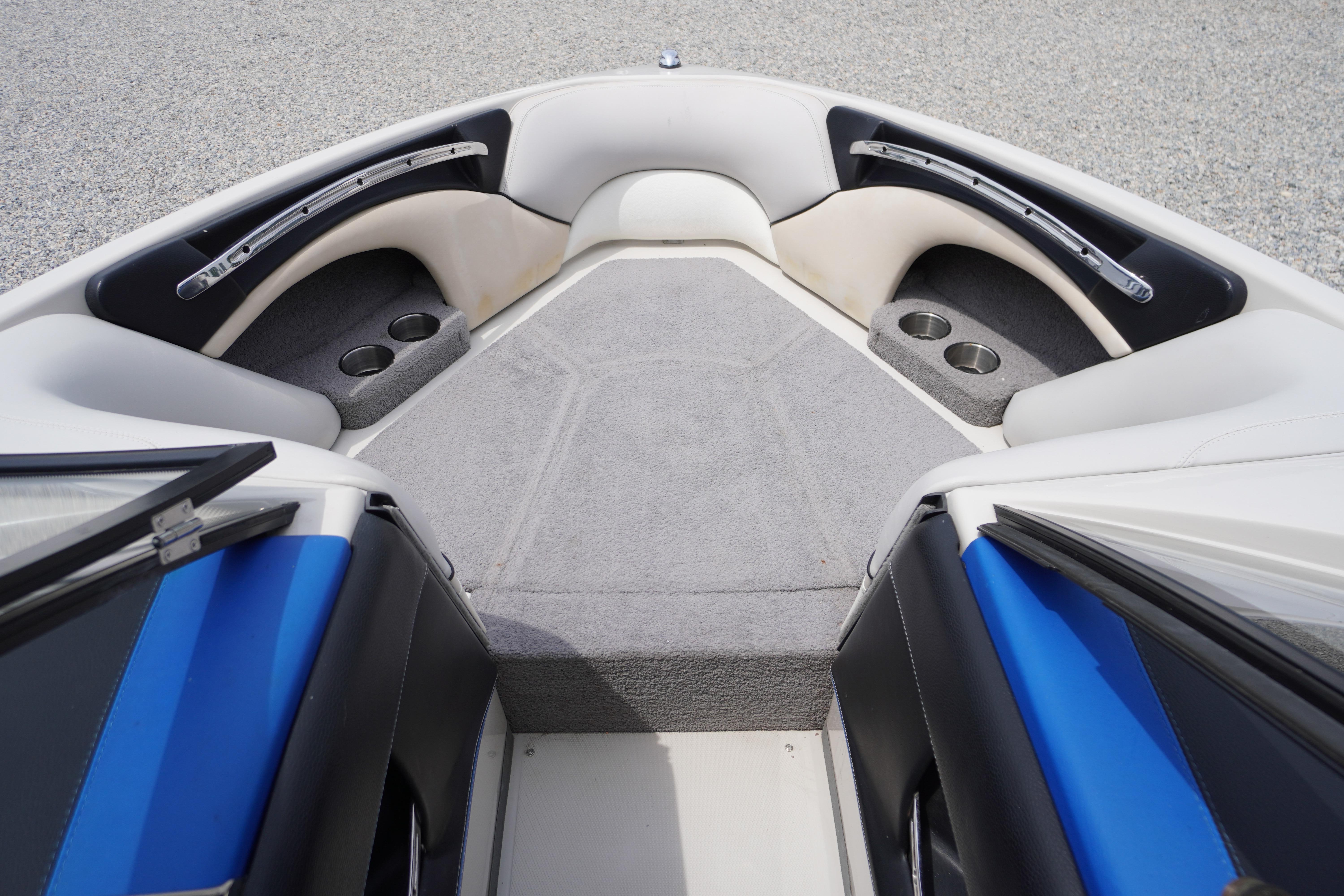 Interior of 2011 Malibu Wakesetter 21 VLX boat with seating and cup holders.