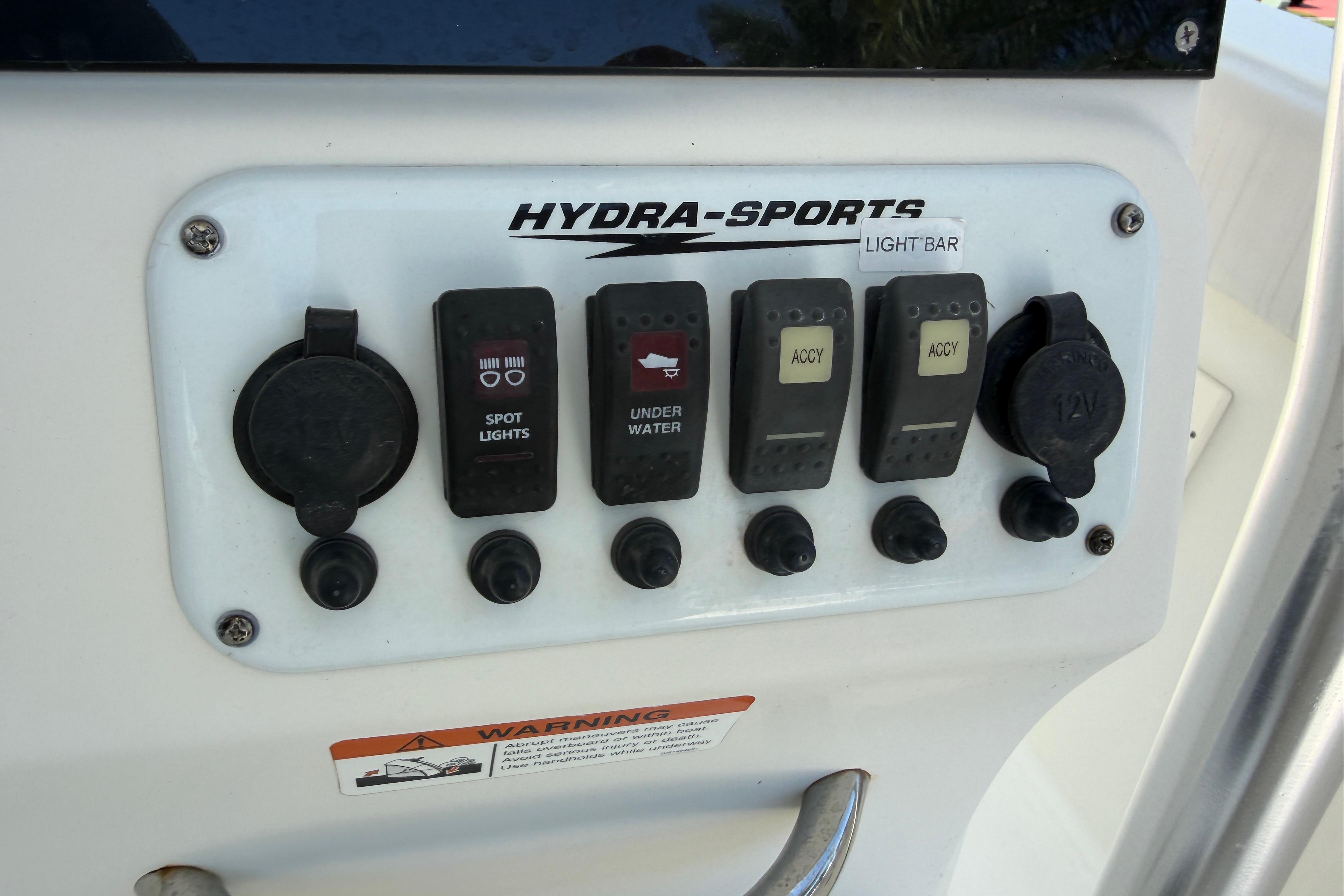Control panel of a 2008 Hydra-Sports Vector 2900 CC boat with various switches.
