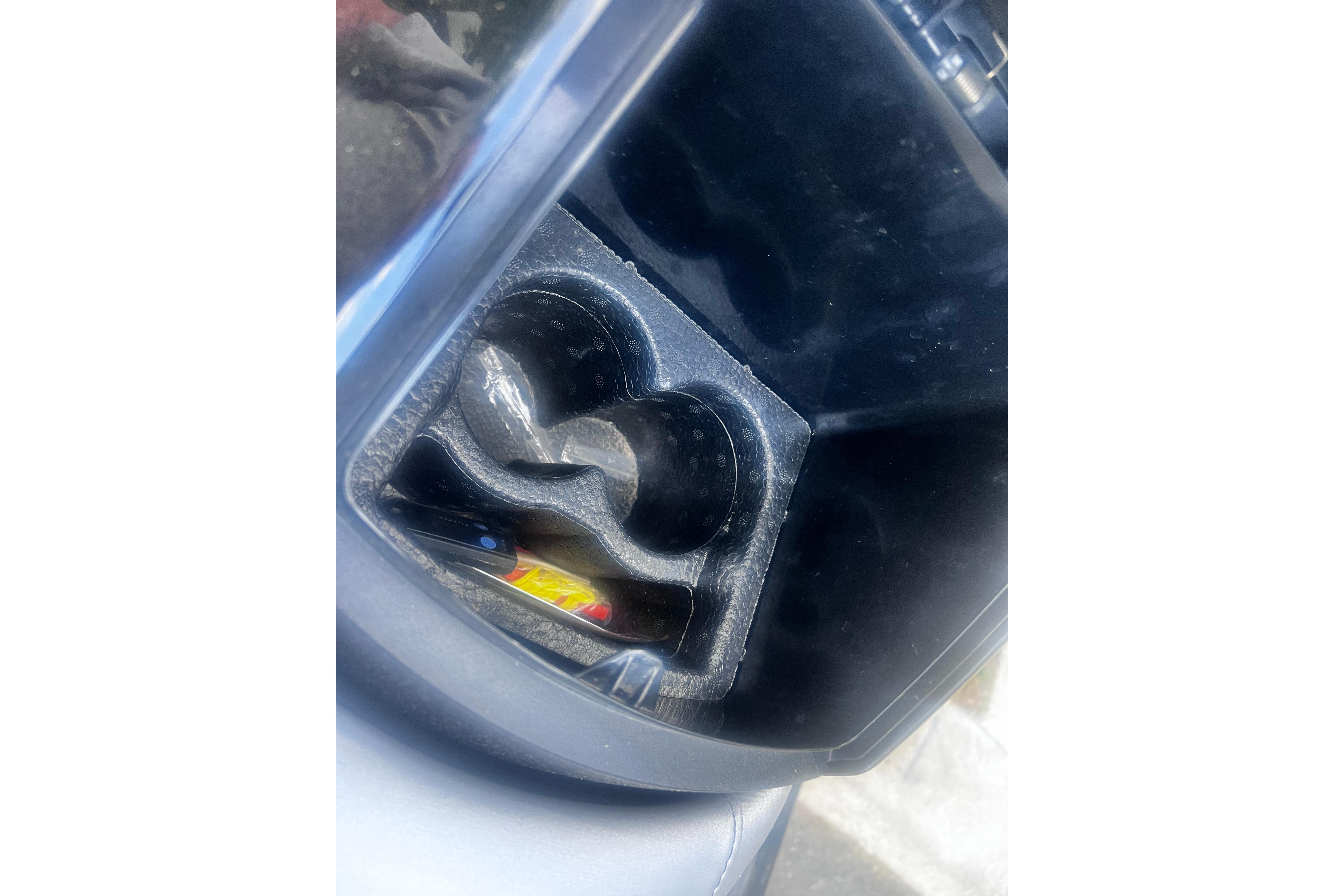 Cup holder and storage compartment in a 2016 Yamaha WaveRunner FX Cruiser SVHO.