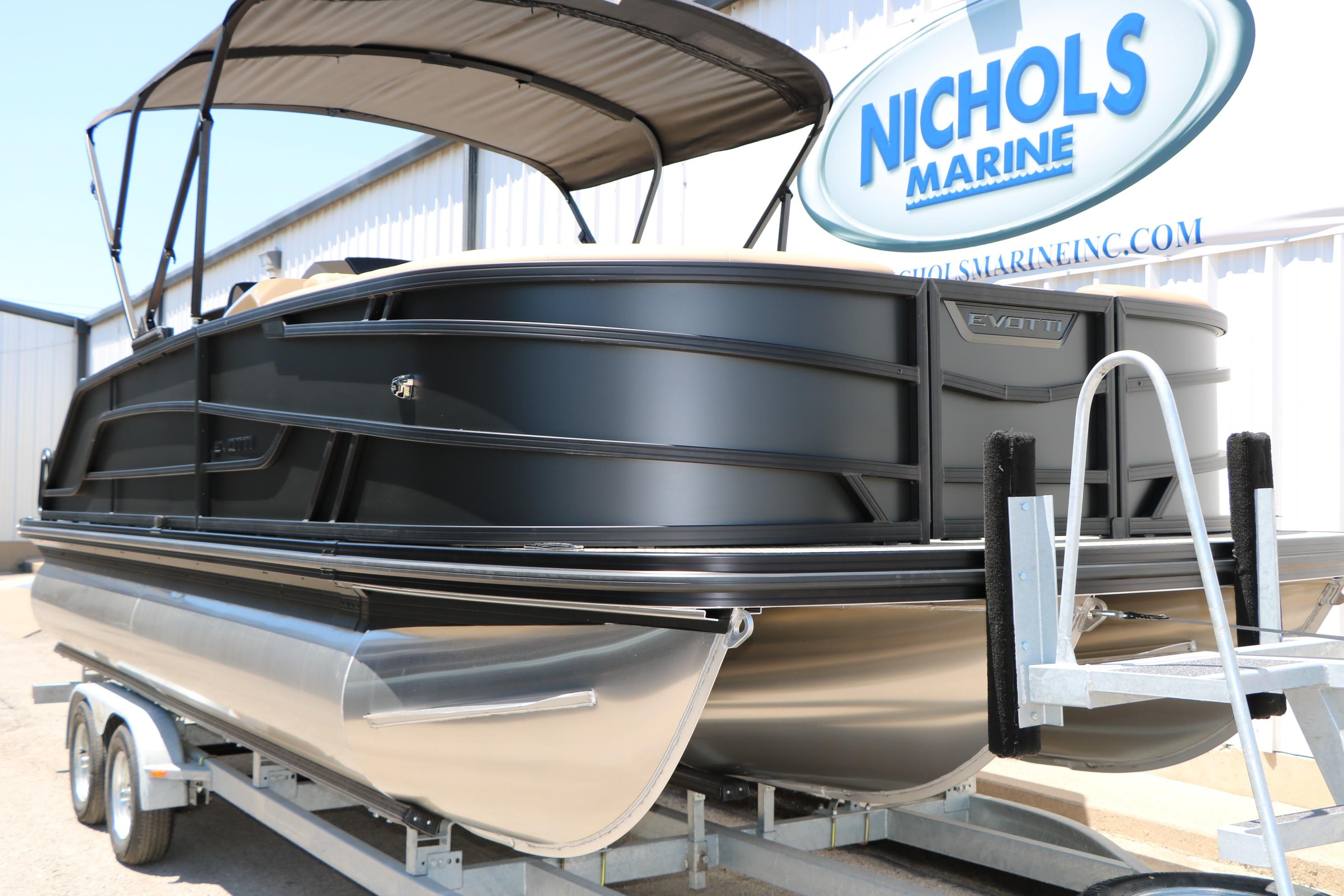 2026 Evotti 521CS pontoon boat on trailer at Nichols Marine dealership.