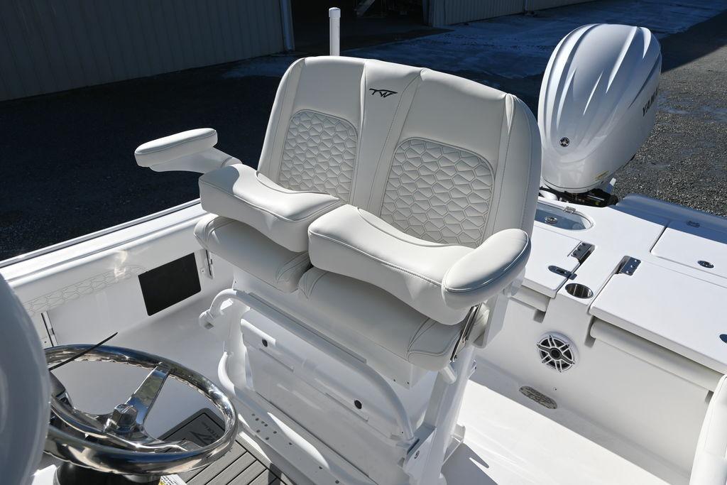 2026 Tidewater 2500 Carolina Bay boat interior with luxurious seating and modern steering wheel.