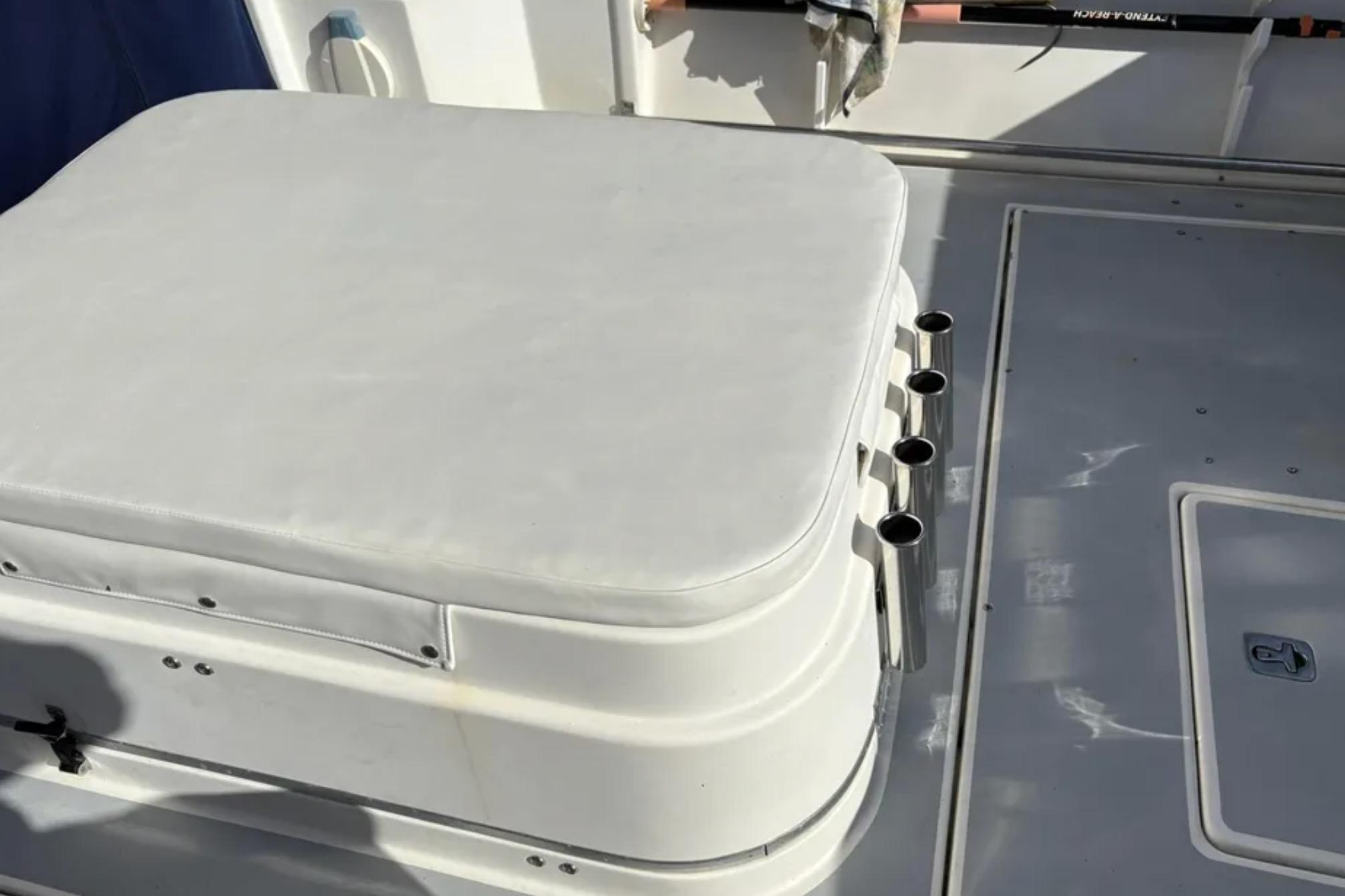 2005 Albin 28 Tournament Express boat deck with cushioned seating and rod holders.