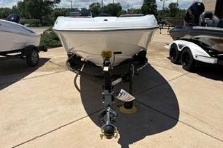 2026 Tahoe T16 boat on trailer, parked outdoors on sunny day.