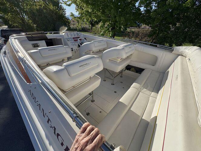 2002 Advantage Victory boat interior with white seating and dashboard controls.