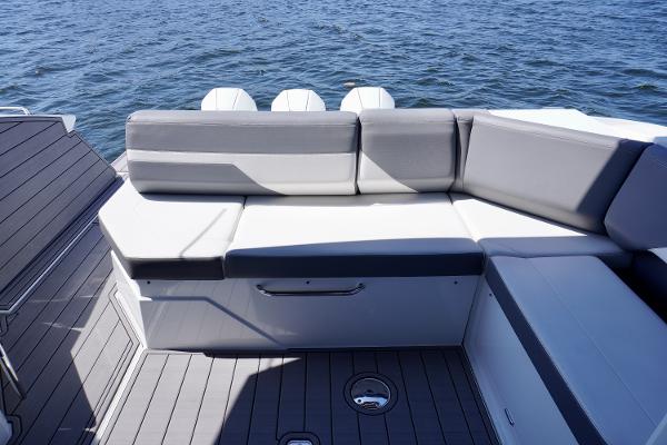 2020 Cruisers Yachts 38 GLS OB with gray seating, overlooking the ocean.