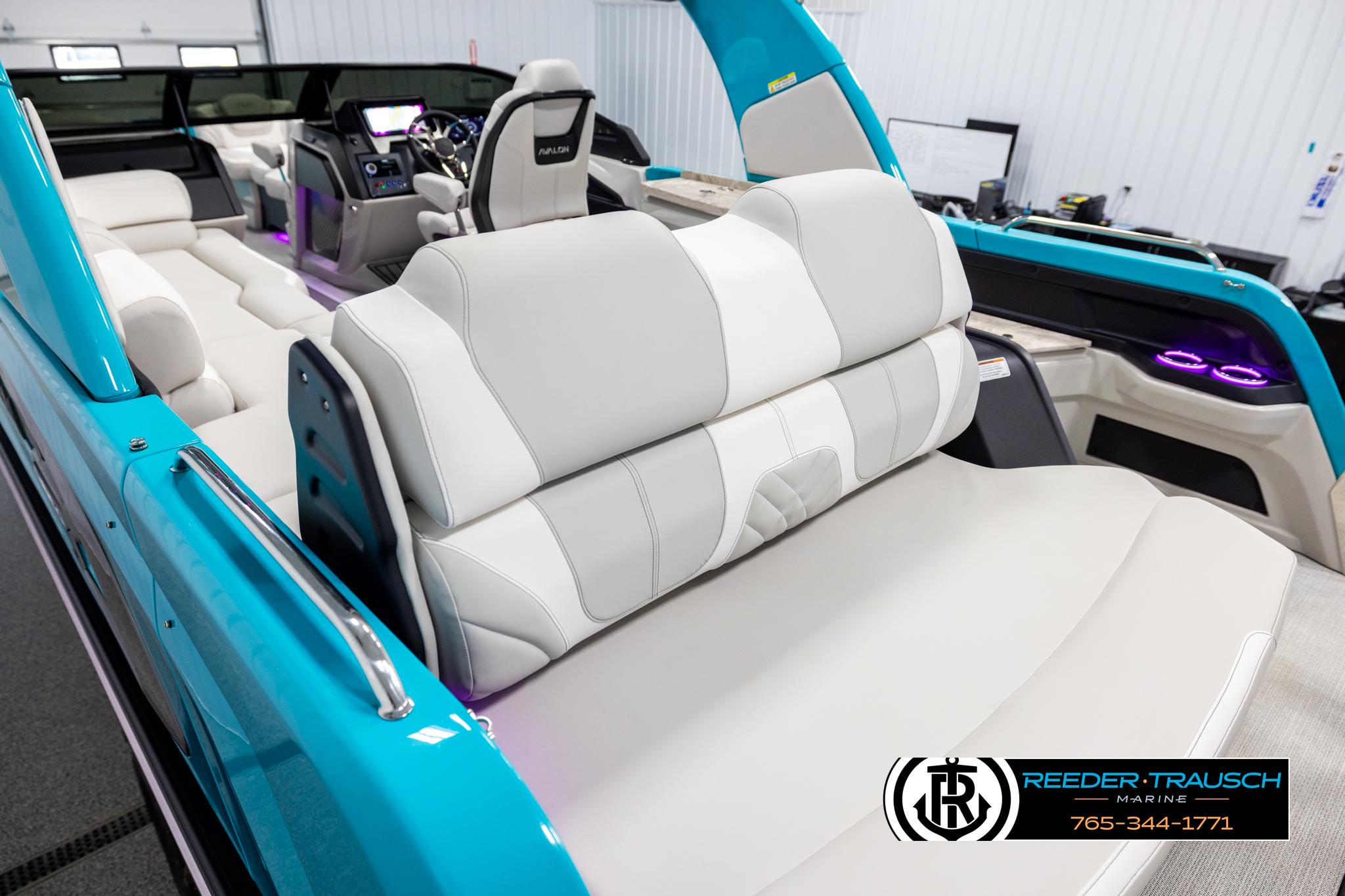 2025 Avalon 2585 Excal VRBW boat interior with white seating and modern dashboard.