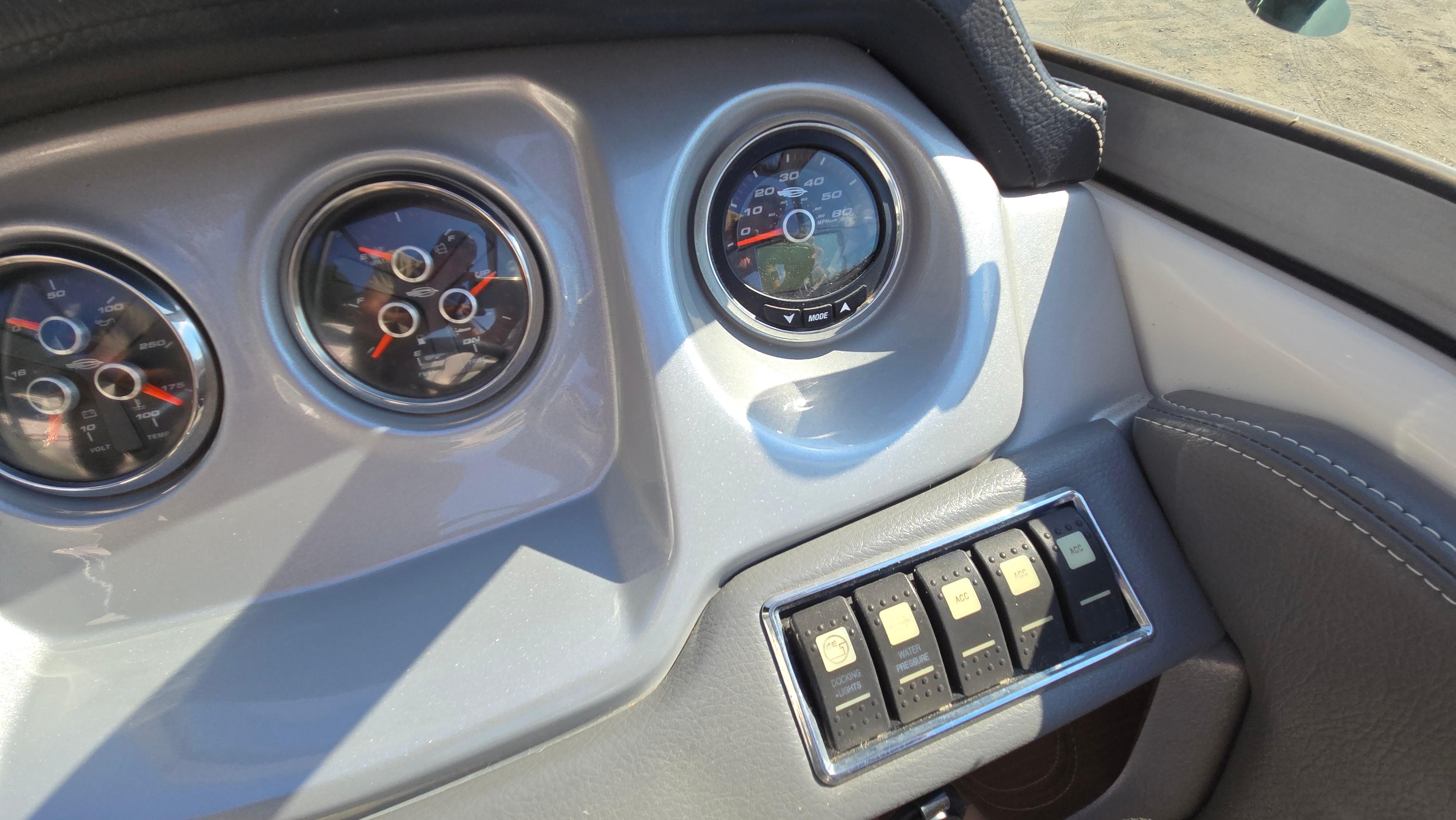 Dashboard of 2018 Chaparral 224 Sunesta boat with gauges and switches.