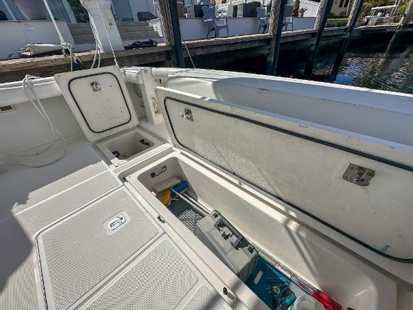 2006 Tiara Yachts 3200 Open deck with storage compartments open.