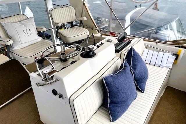 1980 Viking 43 Convertible yacht interior with helm, seating, and nautical decor.