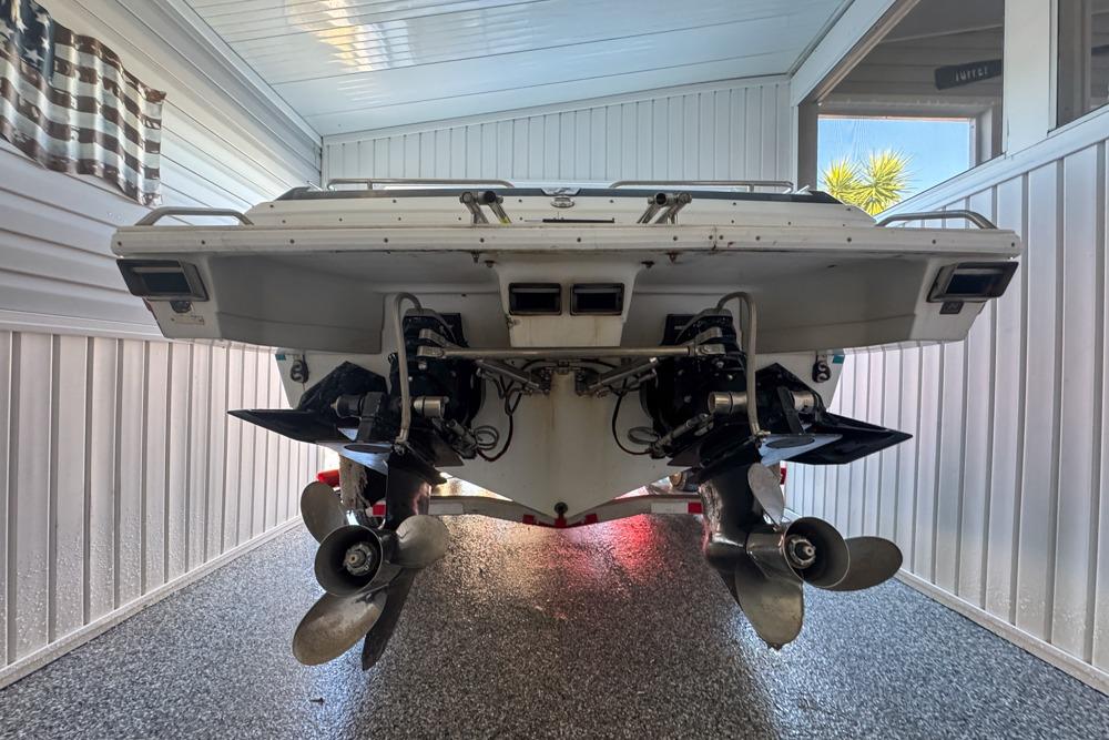 1989 Formula 292 SR-1 boat in garage, rear view showing dual propellers.