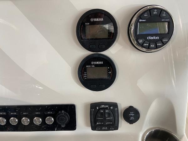 Control panel of a 2024 Key West 250 Bay Reef boat with Yamaha and Clarion gauges.