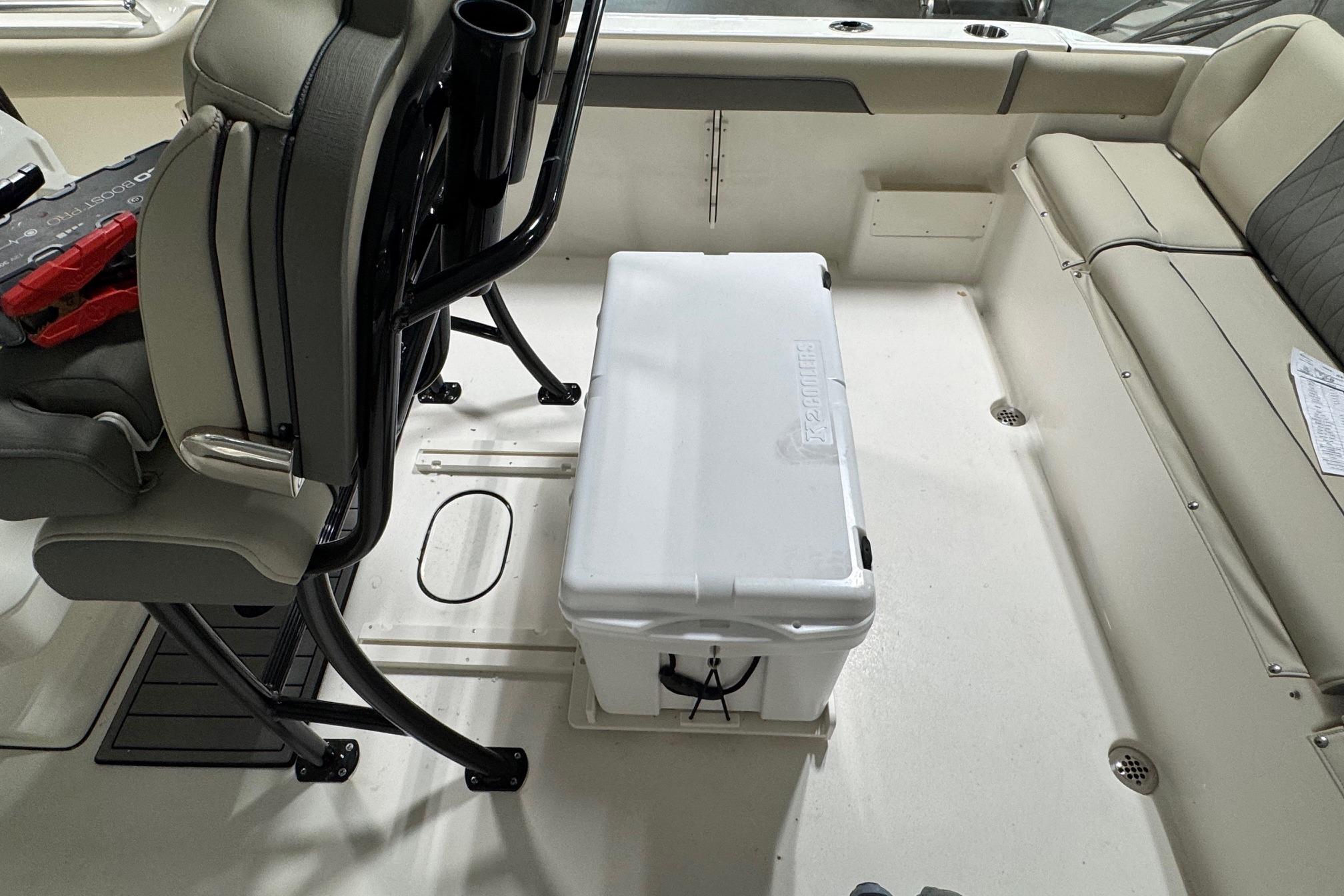 Interior of 2026 Key West 239 FS boat with seating and cooler.