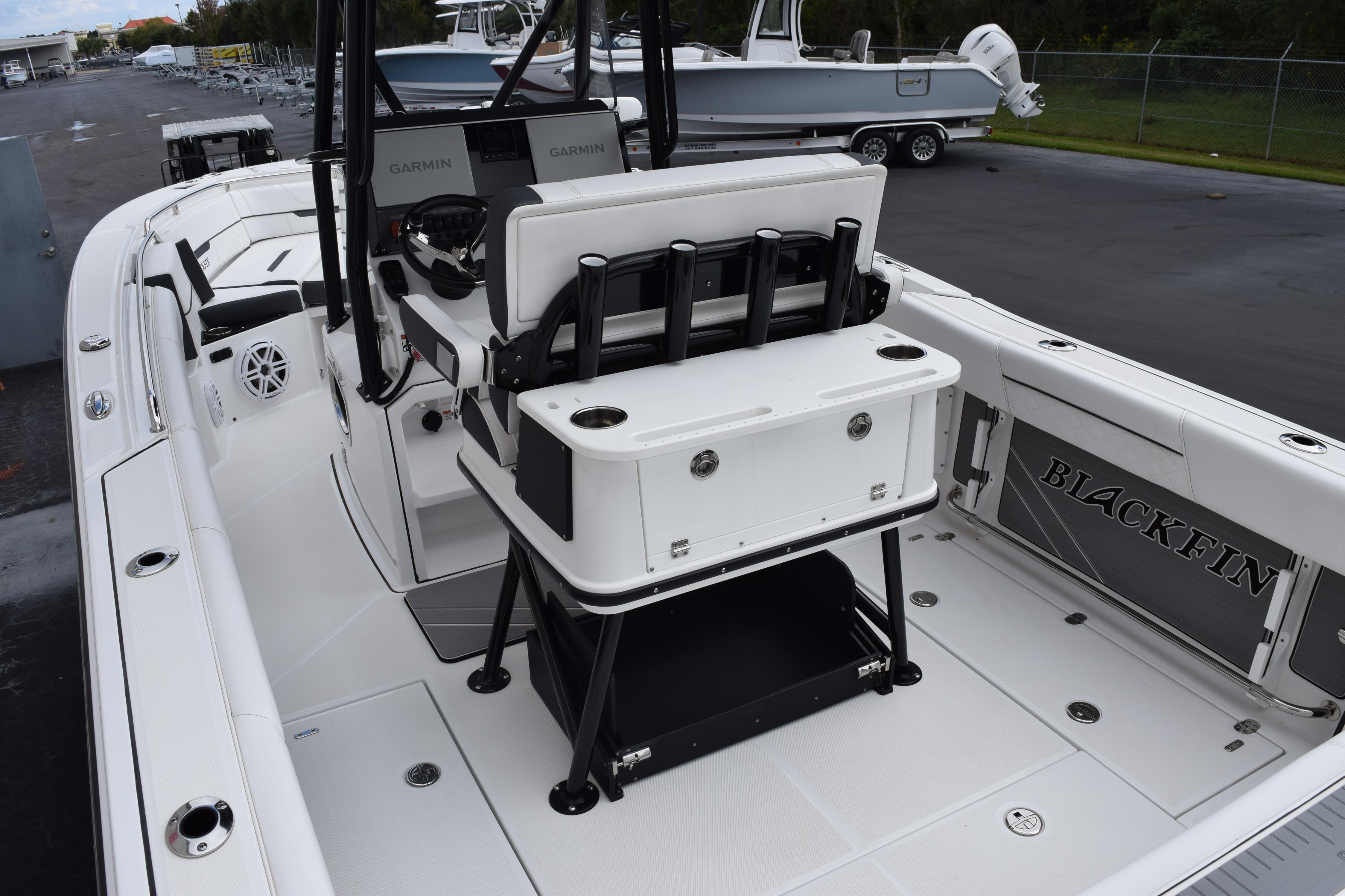 2023 Blackfin 252 CC boat interior with seating and fishing rod holders.