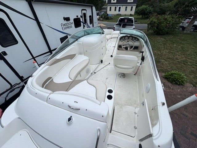 The image shows the cockpit of a 2003 Glastron DX 235 boat.