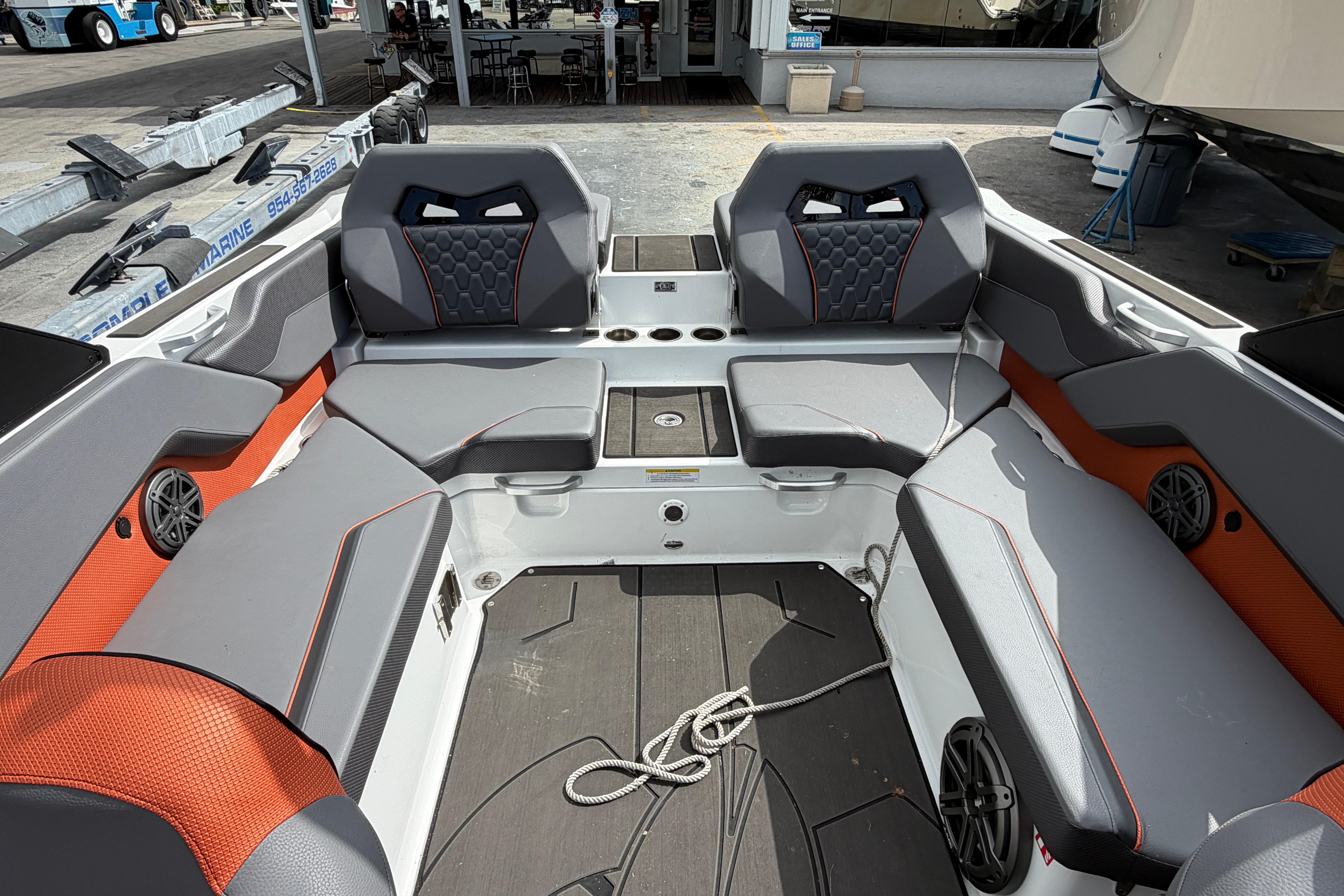Interior of 2026 Scarab 235 LX boat with modern seating and sleek design.