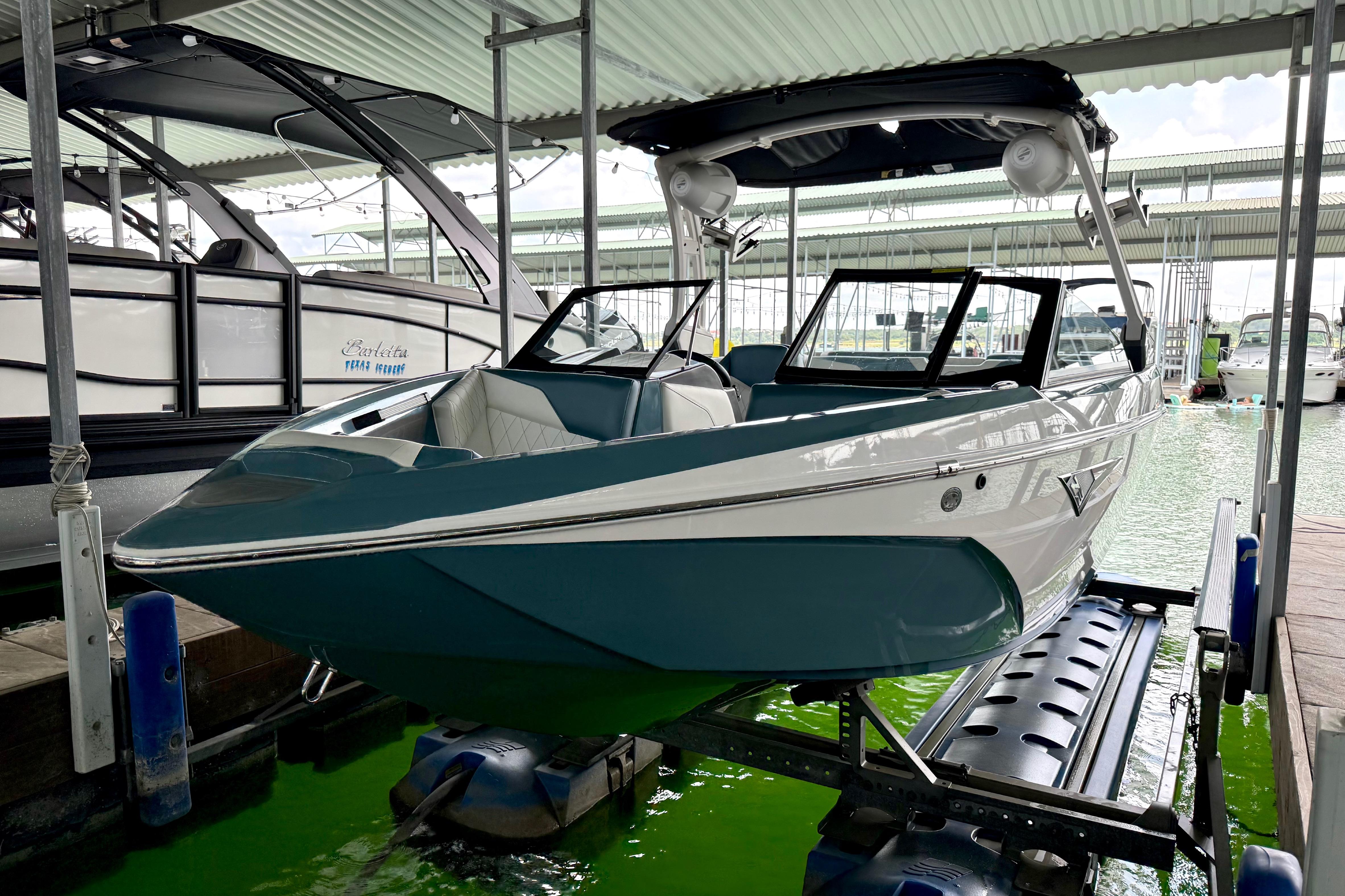 2021 Tige Z3 boat docked in marina, featuring sleek design and modern amenities.