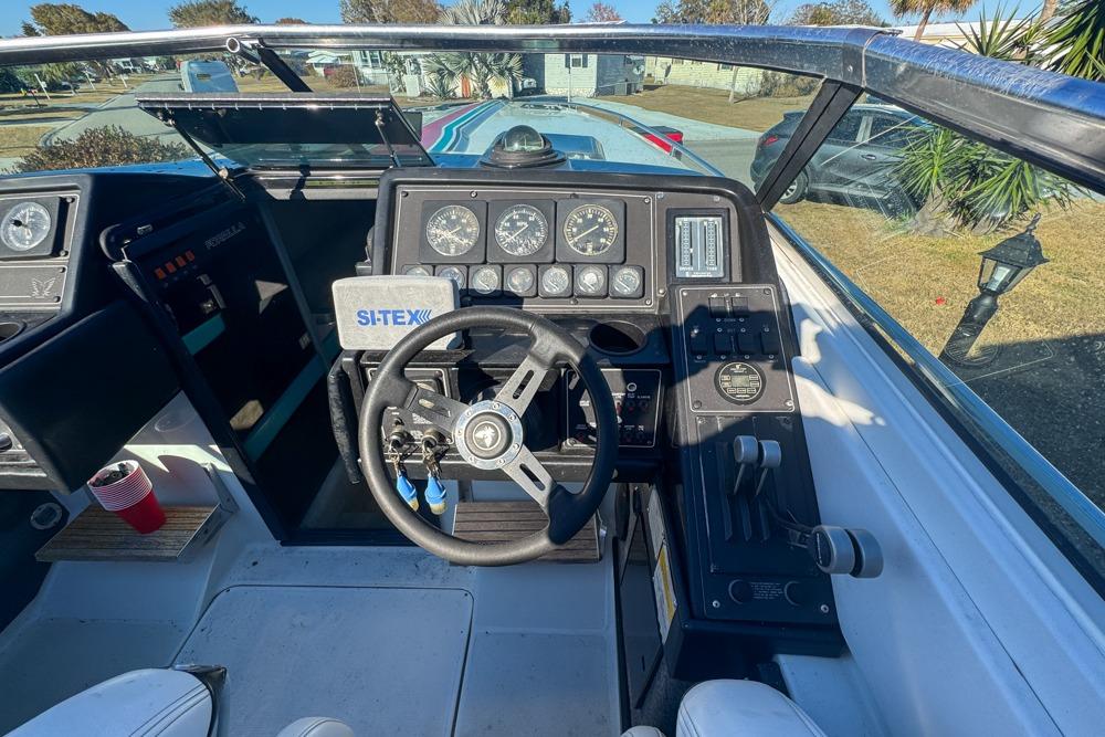 1989 Formula 292 SR-1 boat cockpit with steering wheel, gauges, and controls.