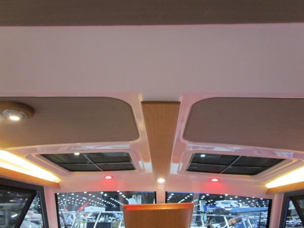 Interior view of 2025 Cutwater C-248 Coupe with modern lighting and sunroof.