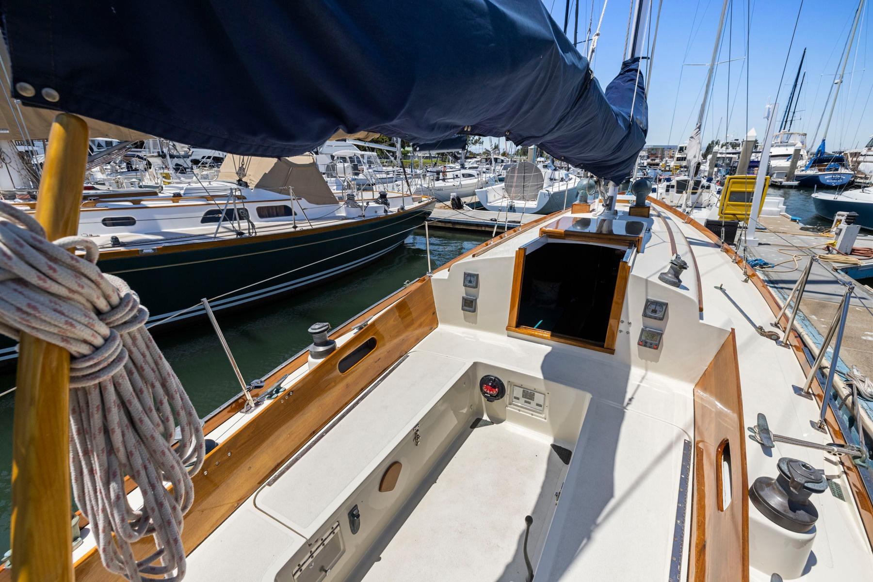Hinckley Pilot 35 sailboat from 1964 docked at a marina, showcasing its classic design.