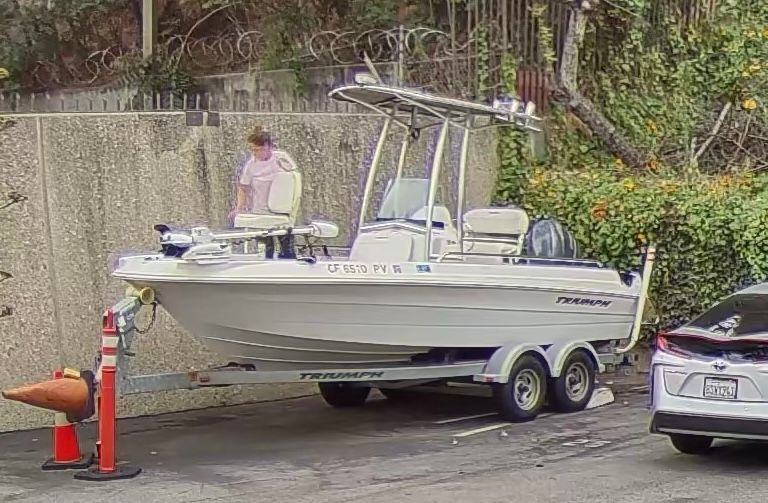 2012 Triumph 190 Bay boat parked on trailer.