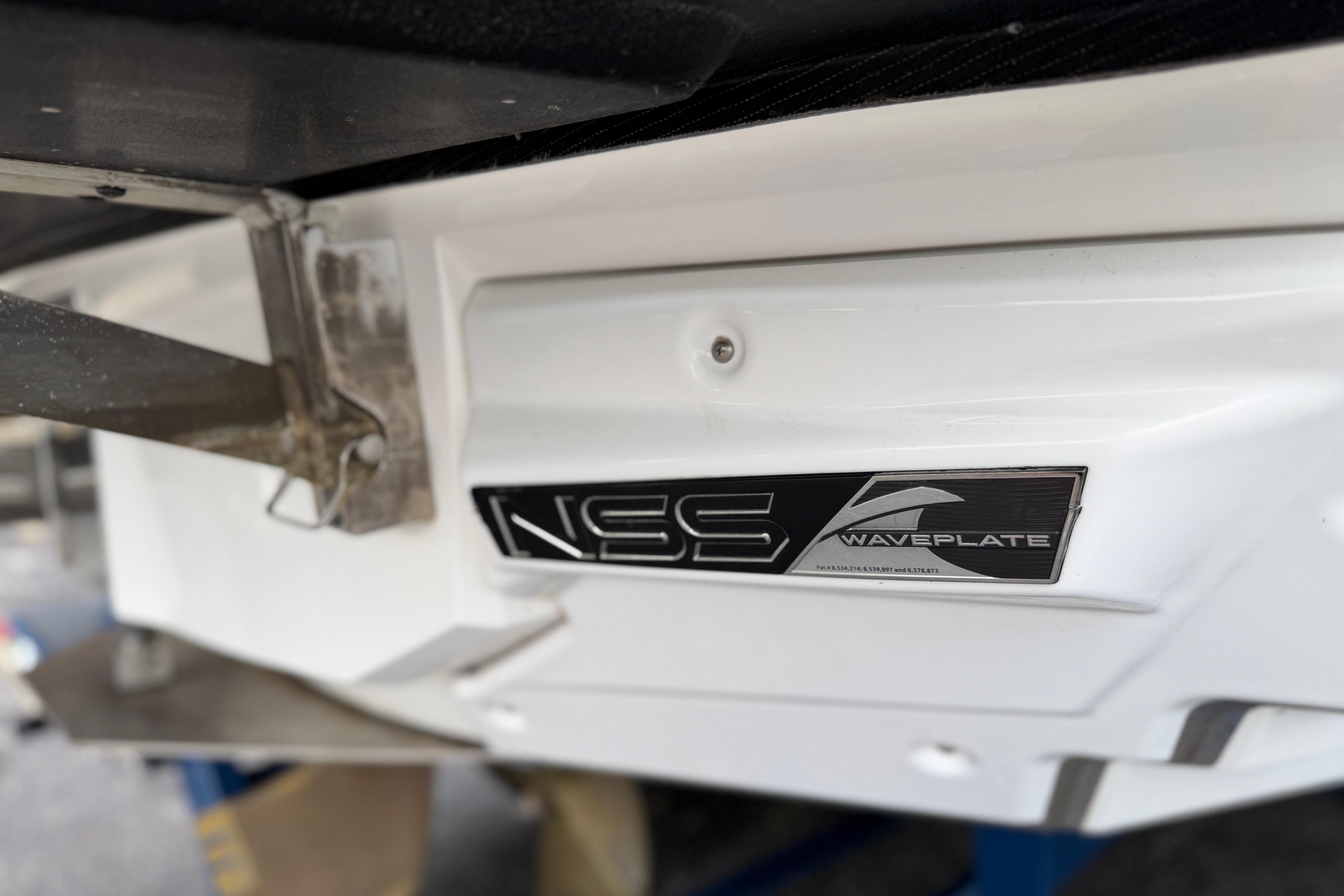 Close-up of 2016 Naitique G25 NSS Waveplate on boat hull.