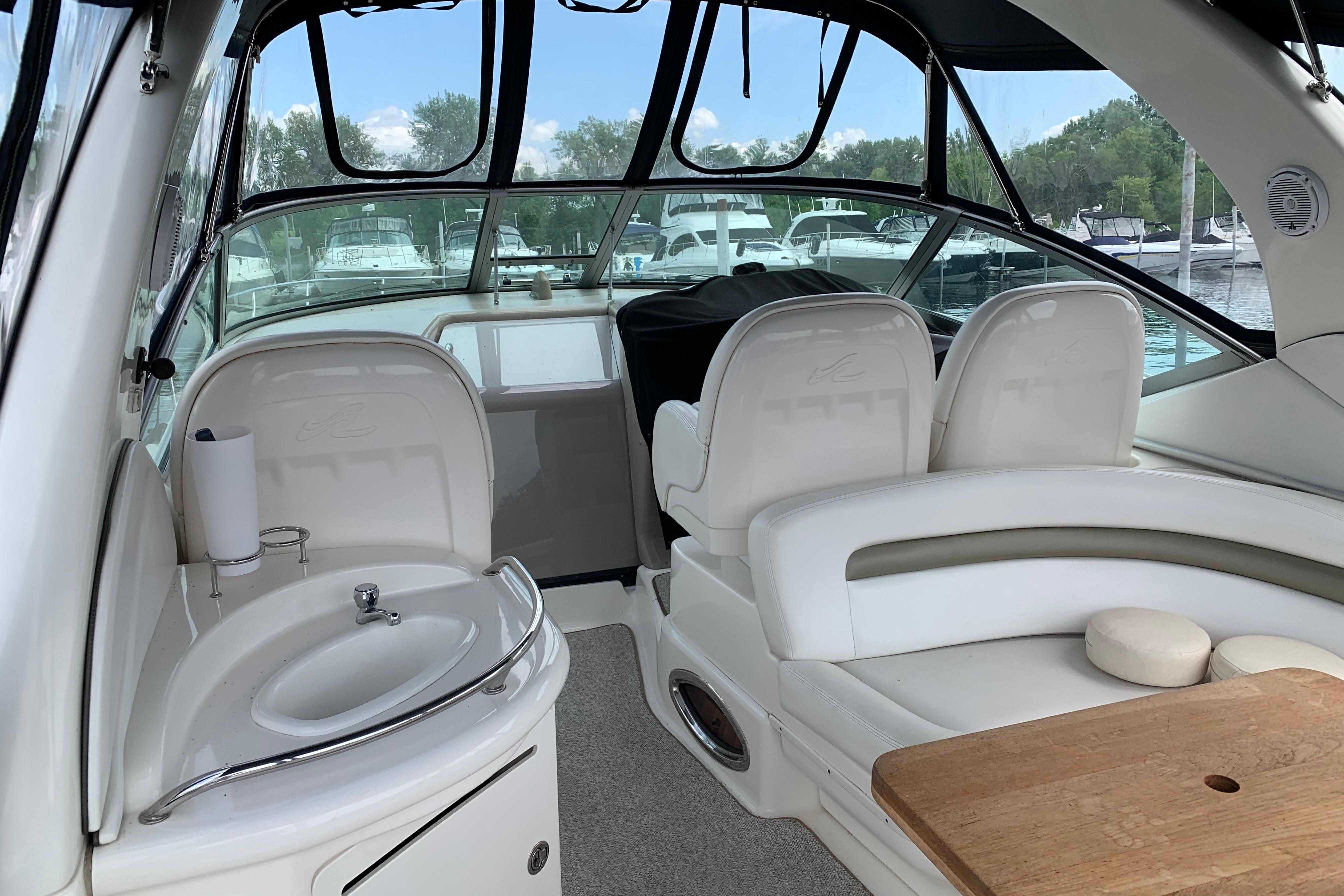 Interior of 2007 Sea Ray 340 Sundancer yacht with seating and sink.