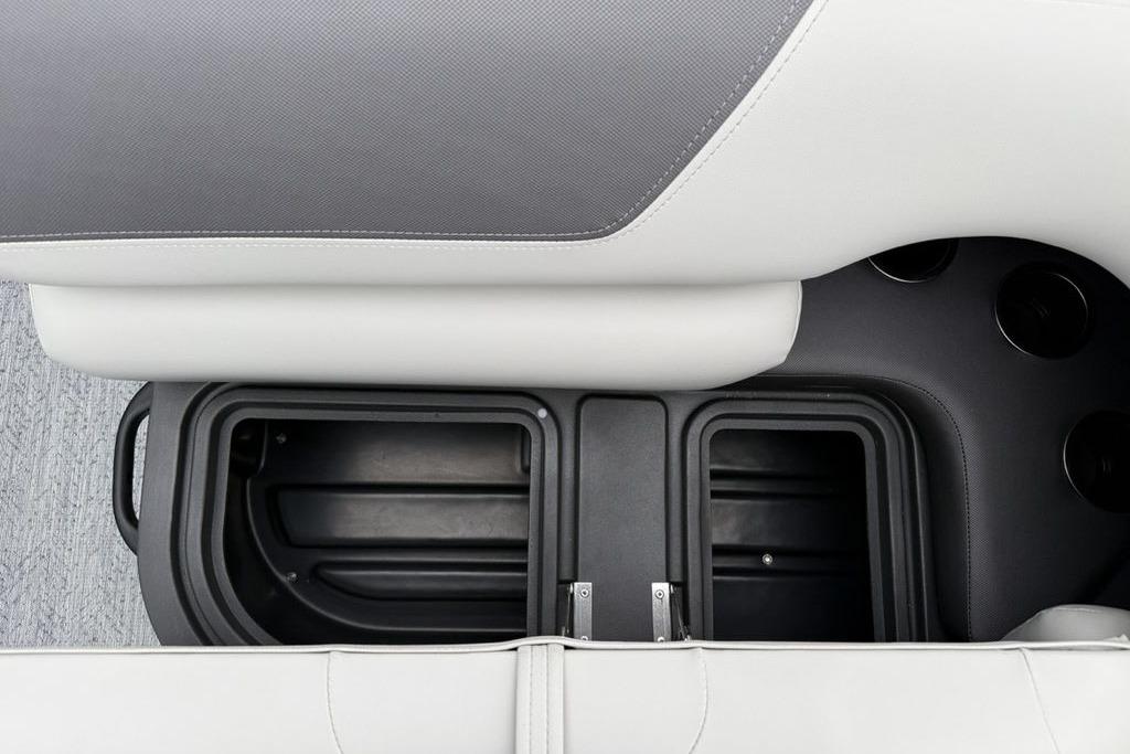2026 Sun Tracker Fishin' Barge 20 DLX storage compartments and seating detail.
