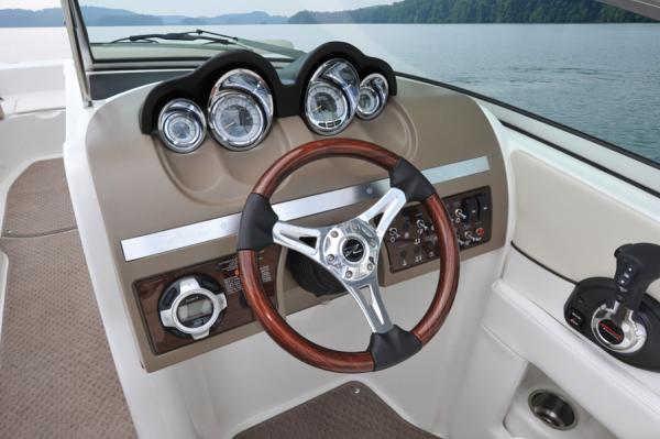 Manufacturer Provided Image: 2013 Sea Ray 260 Sundeck boat dashboard with steering wheel and gauges.