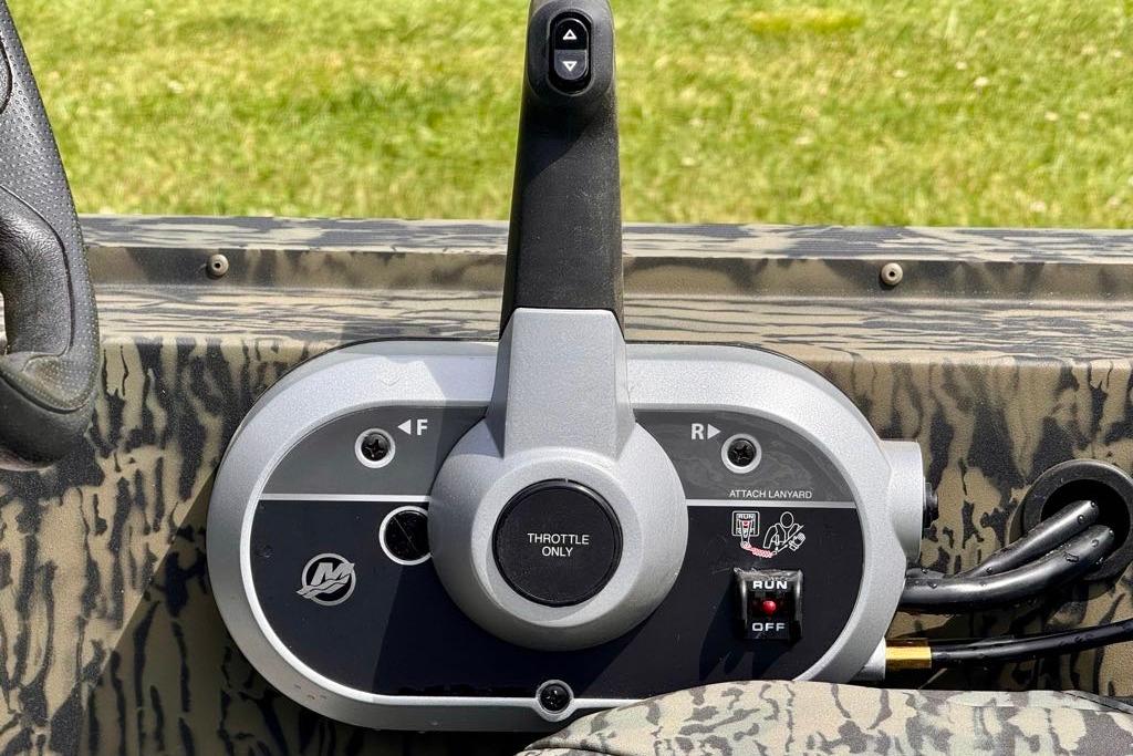 Control panel of 2026 Tracker Grizzly 1754 SC boat with throttle and lanyard attachment.