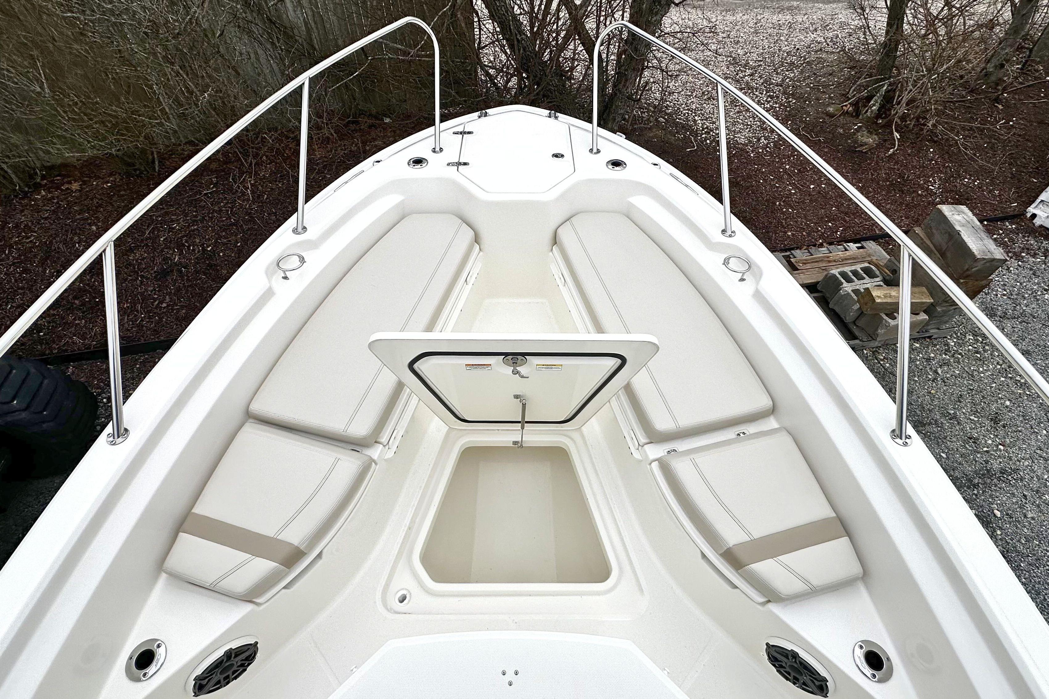 2026 Boston Whaler 280 Dauntless boat interior with seating and storage compartment.